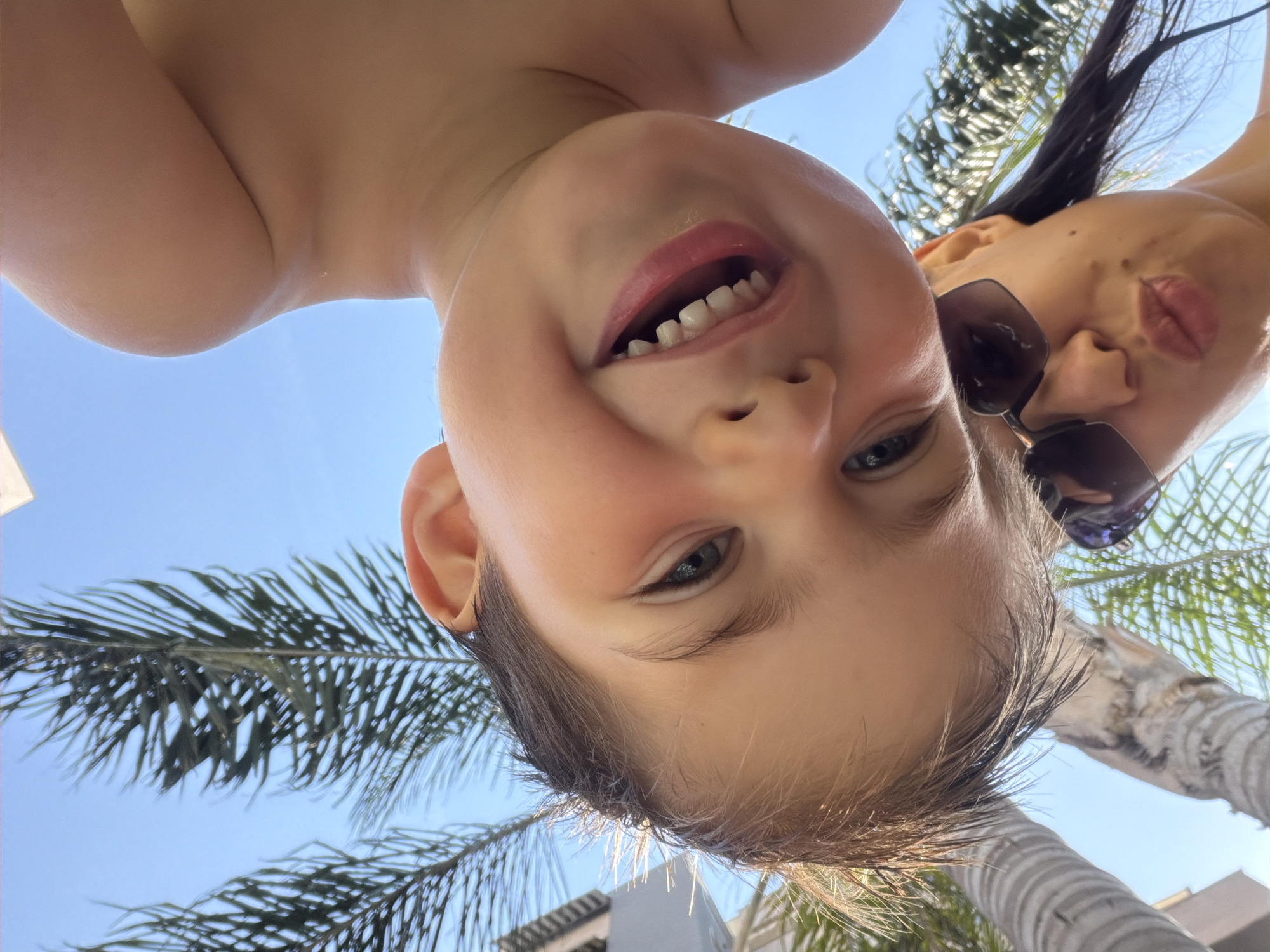 Mother and child enjoy morning poolside leisure time in Valencia
