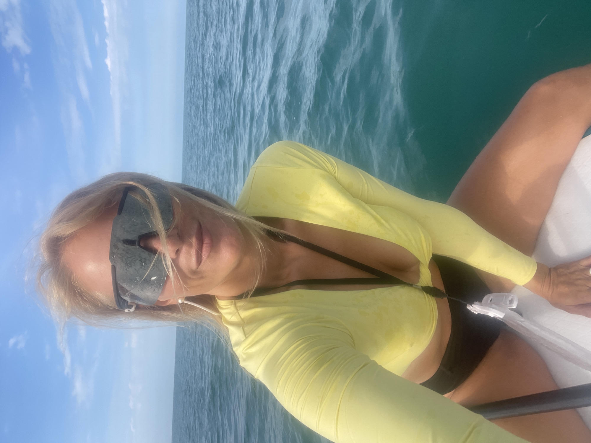 Woman paddleboards in Black Sea off Sochi coast
