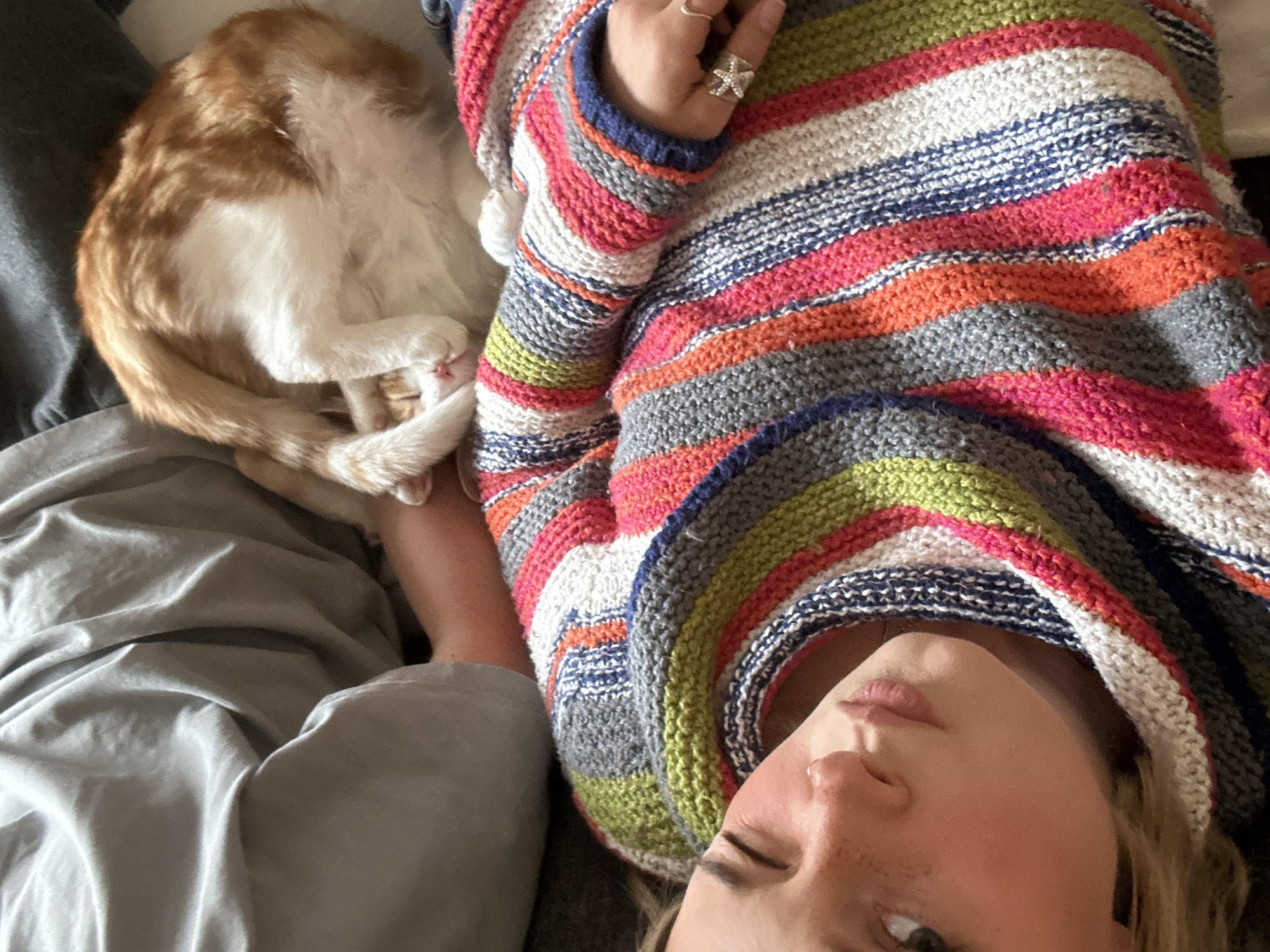 Woman spends quiet moments with cats in Squamish home
