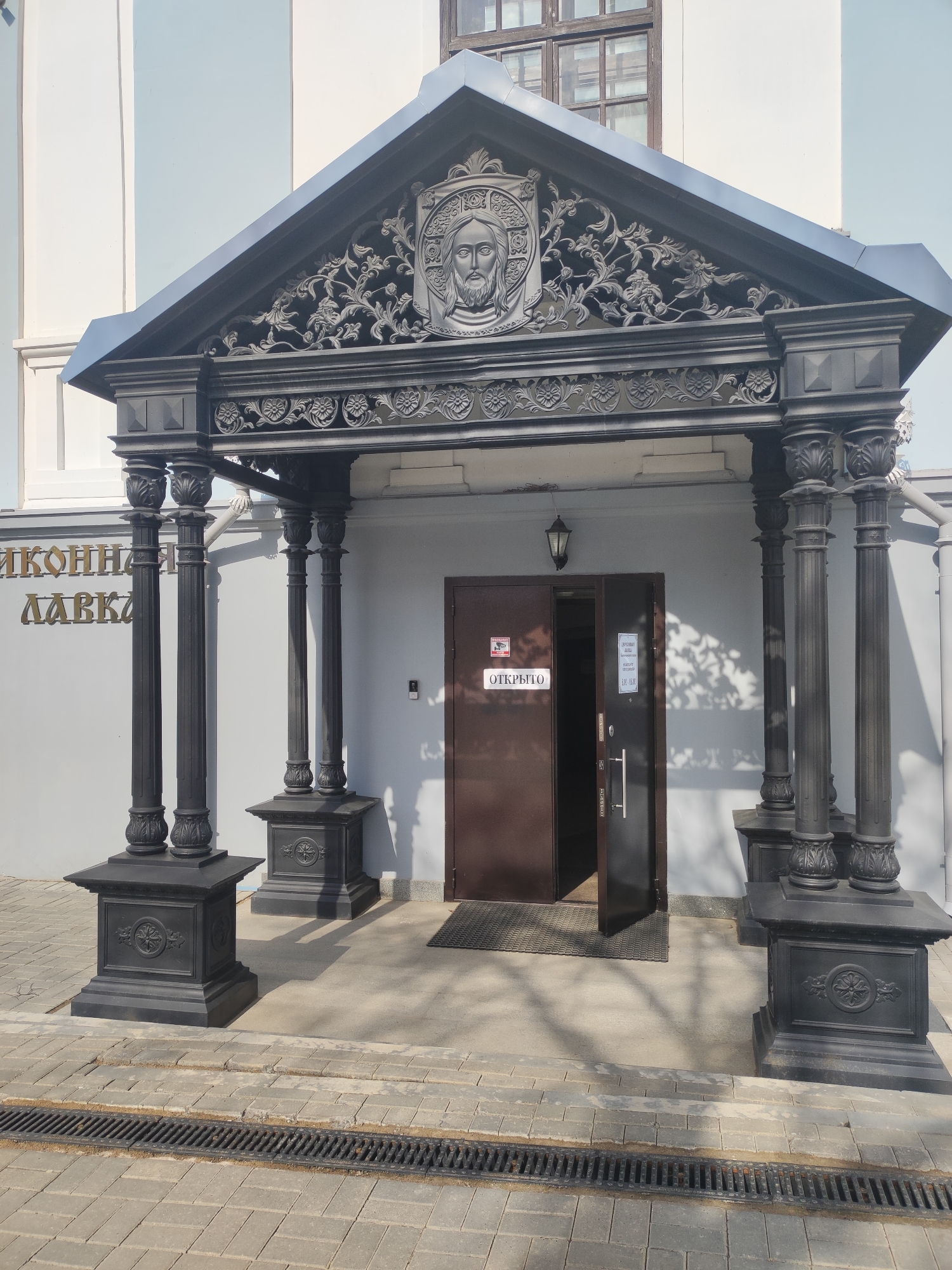 Classical building with white columns documented in Votkinsk, Russia