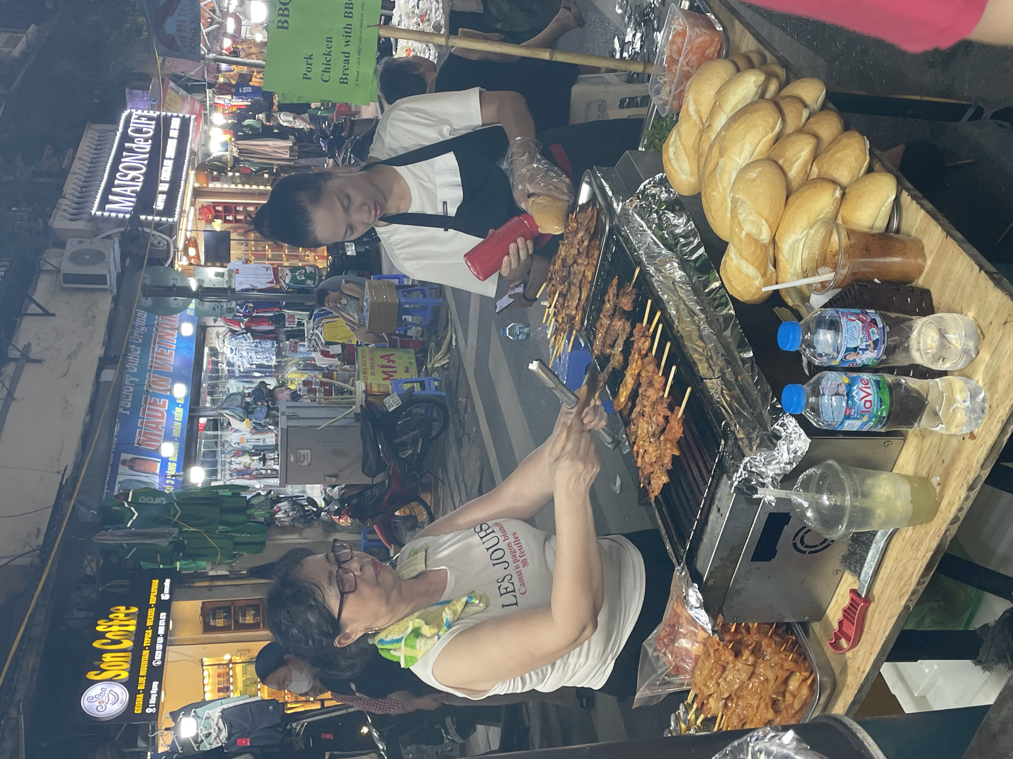 Evening street food market scene in Hanoi