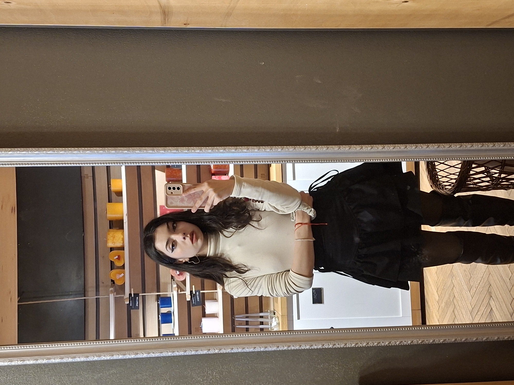 Mirror selfie captured showing person in casual outfit
