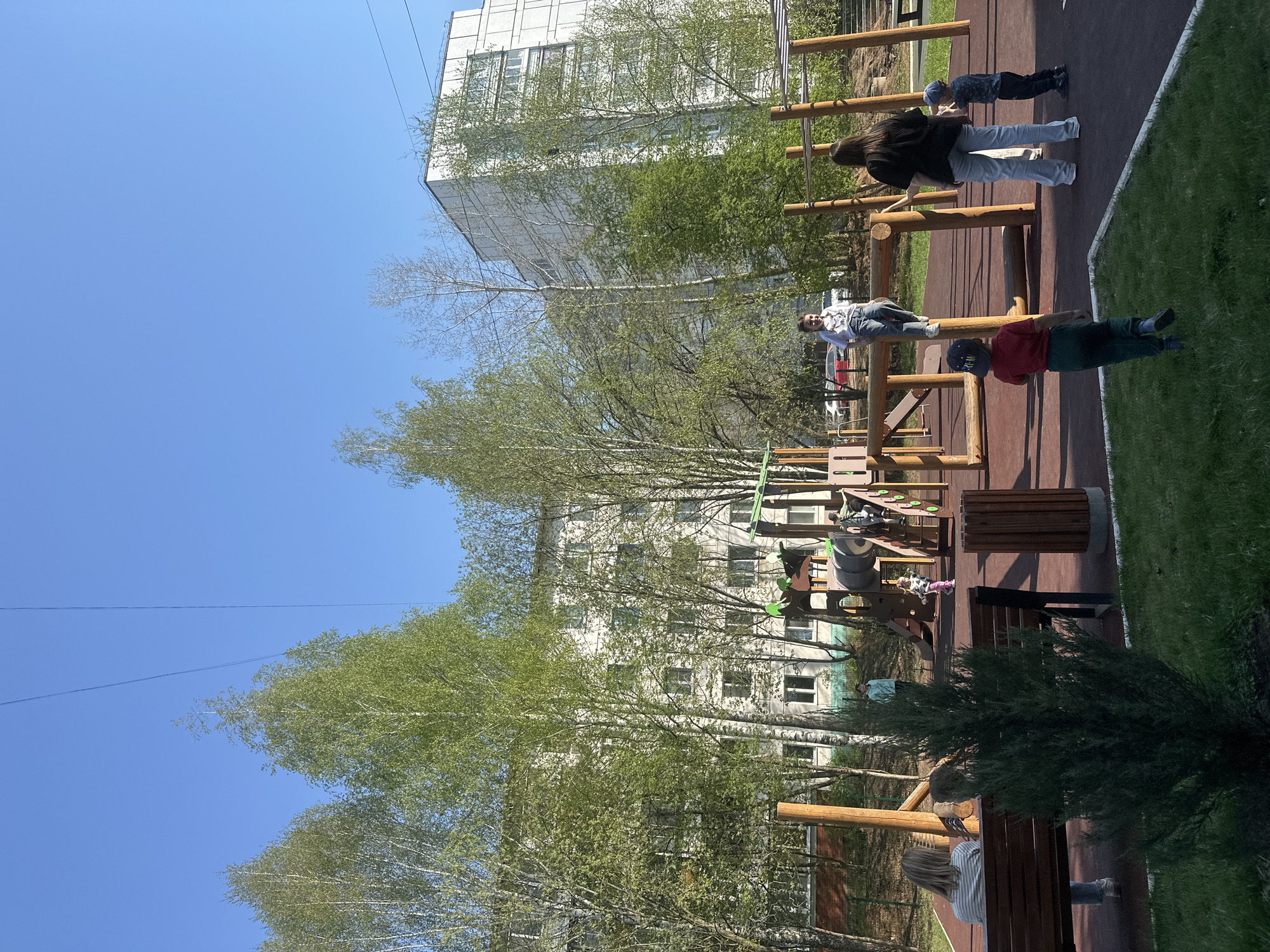Families enjoy afternoon recreation time in Chaikovsky park areas