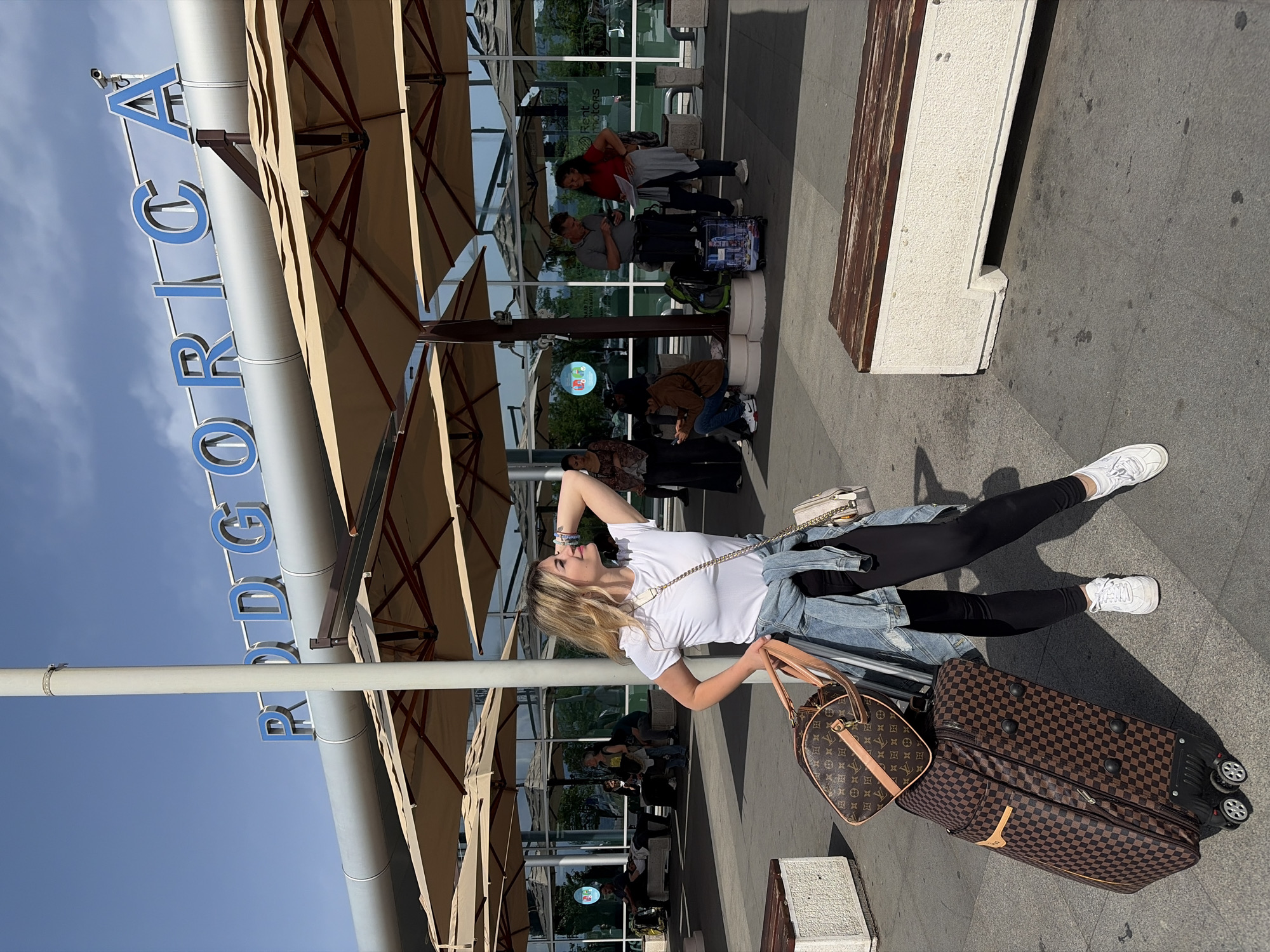 Woman photographed at Podgorica Airport entrance in Montenegro