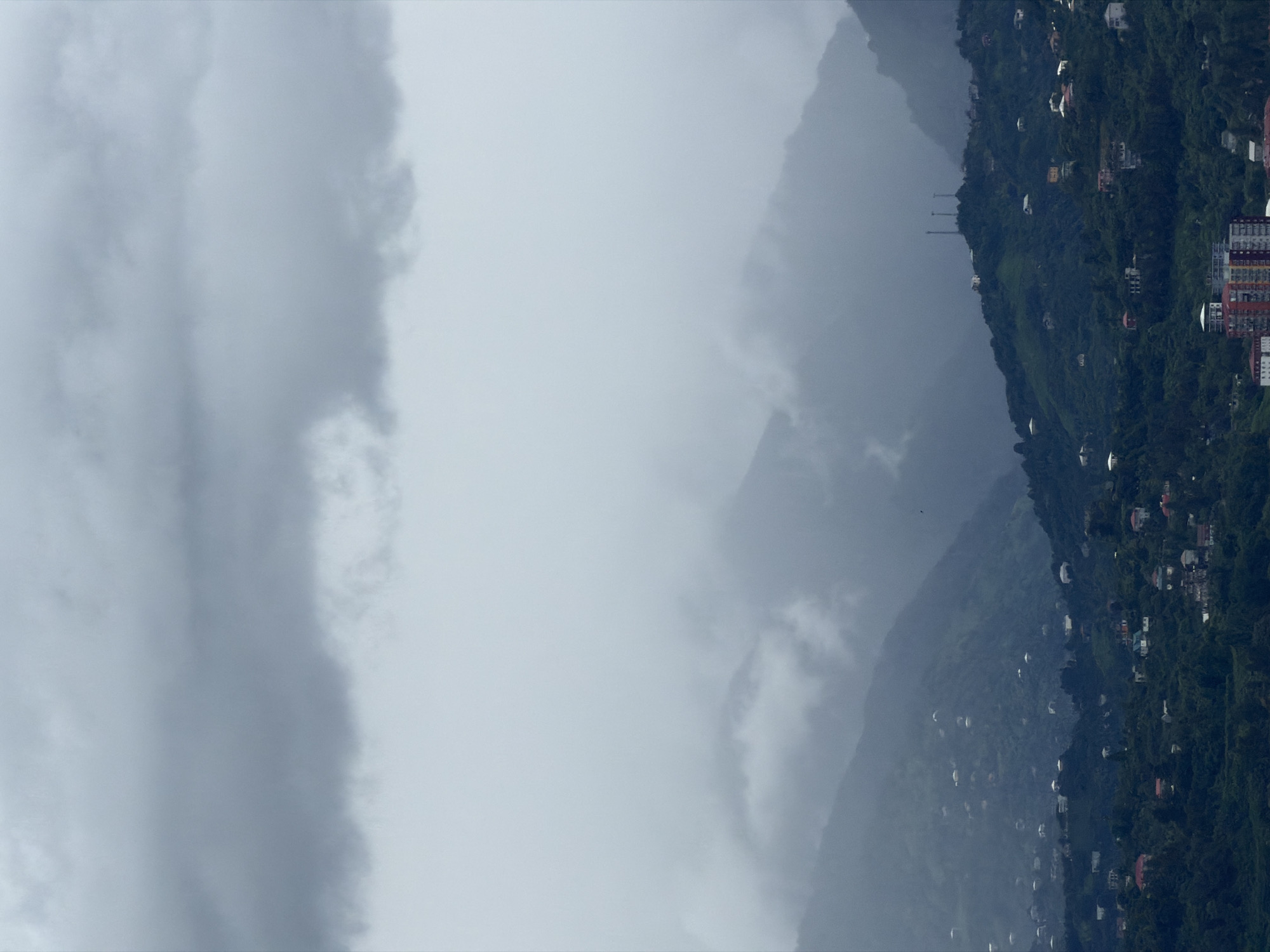 Batumi under heavy clouds, city and coastline on a grey morning
