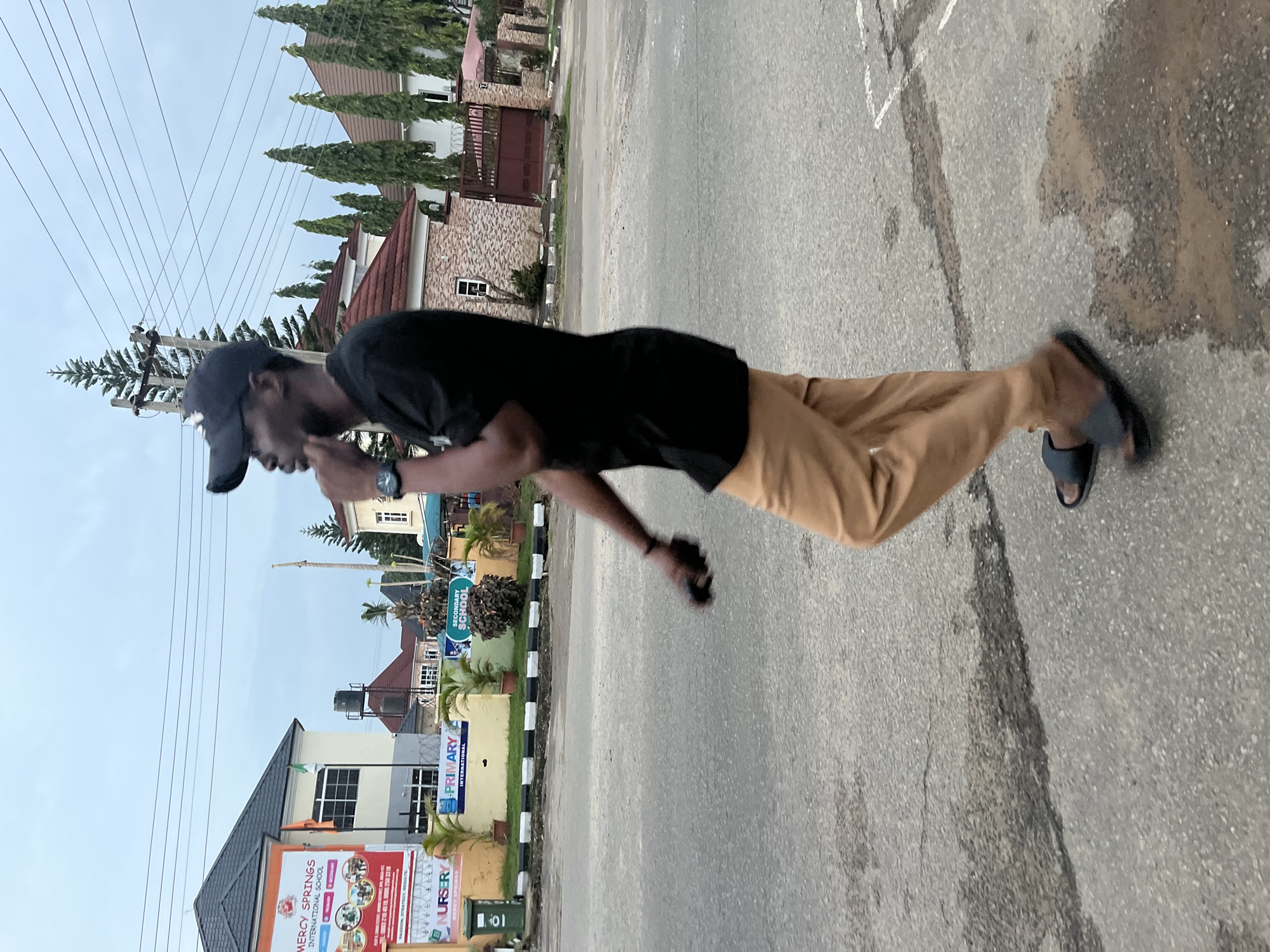 Daily street life unfolds in Abuja Nigeria afternoon