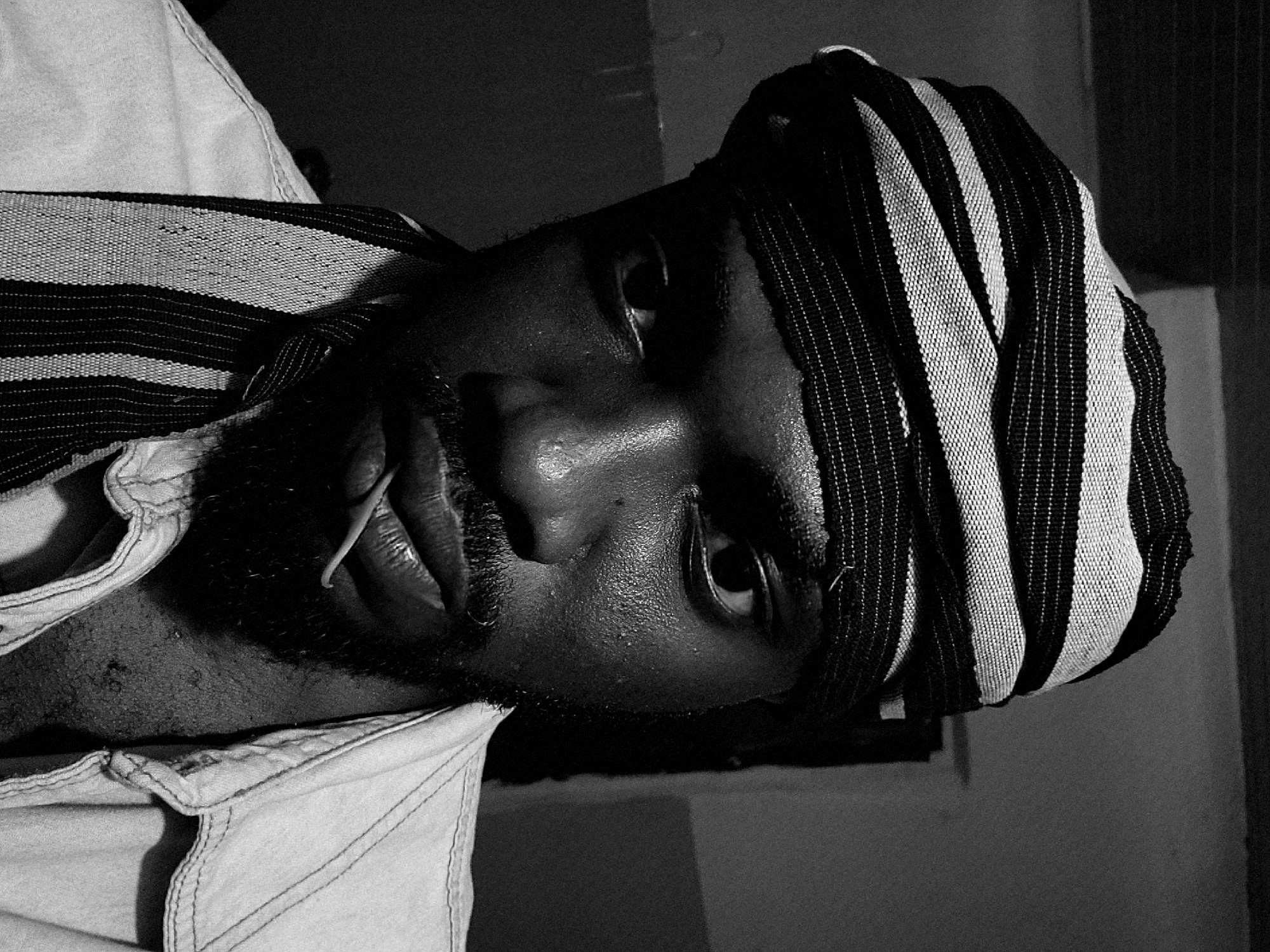 Man in striped headwrap photographed in Jos, Nigeria