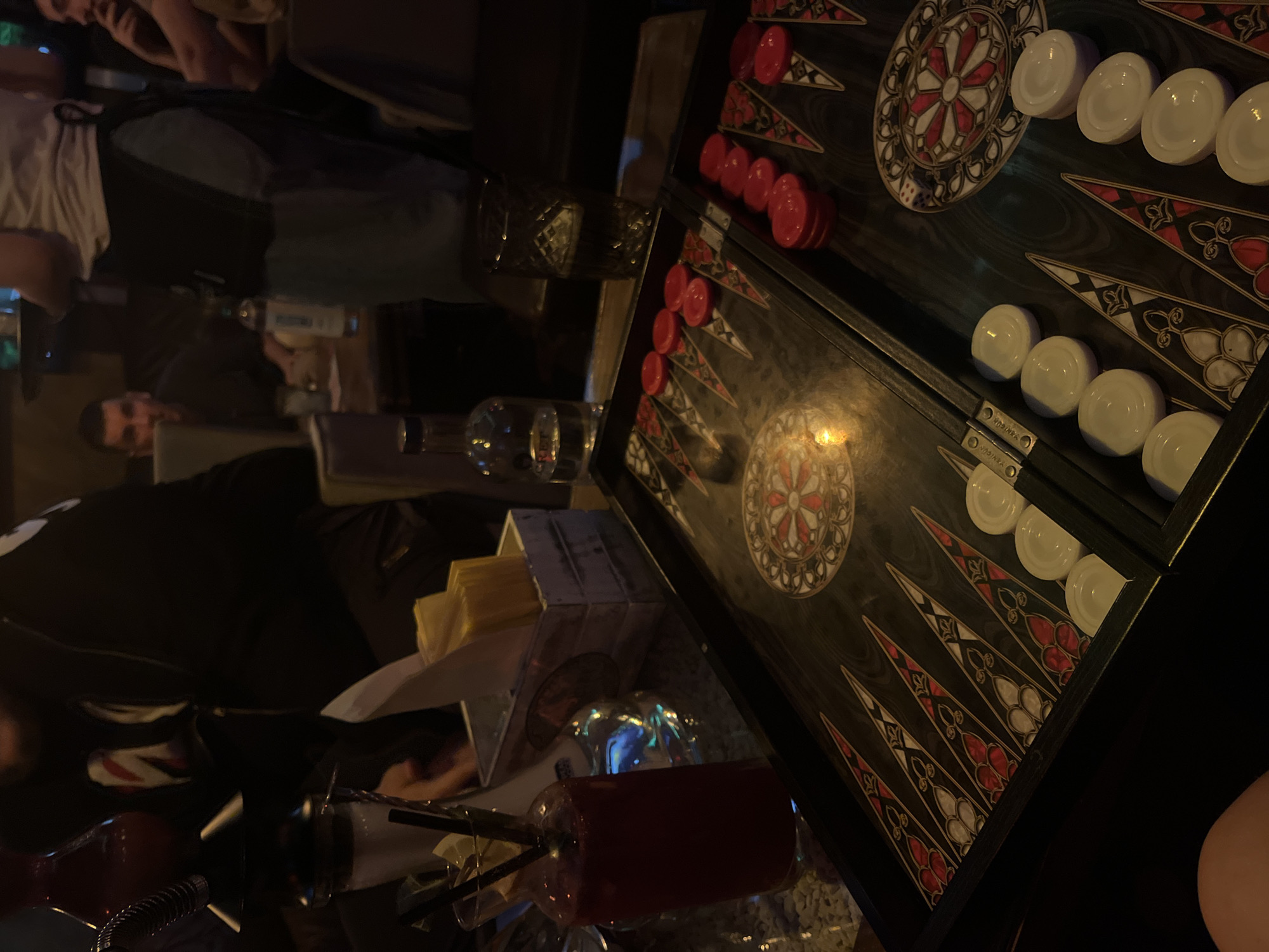 Backgammon game in progress at social gathering in Pleven