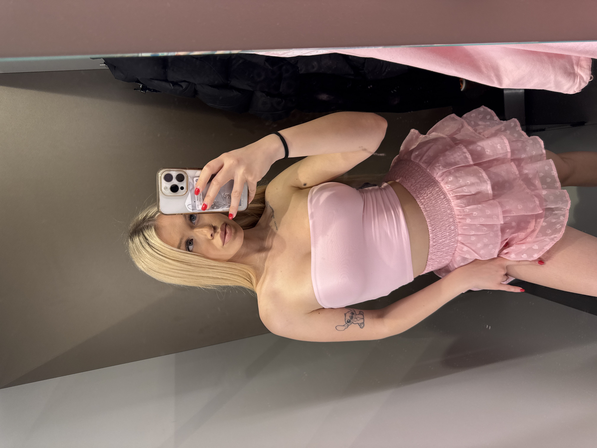 Trying on outfits at a Kudrovo store, selfies in the fitting room