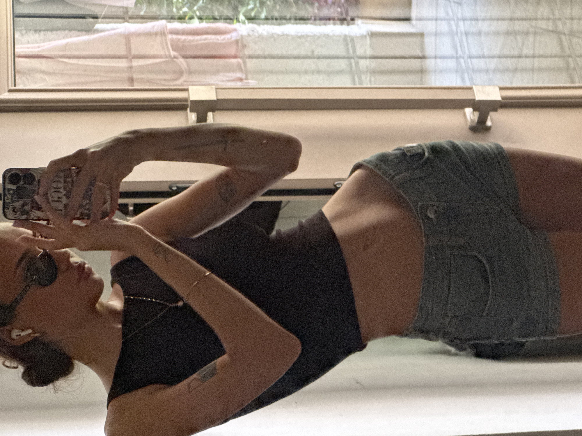 Mirror selfie in a Tel Aviv apartment, ready to head out