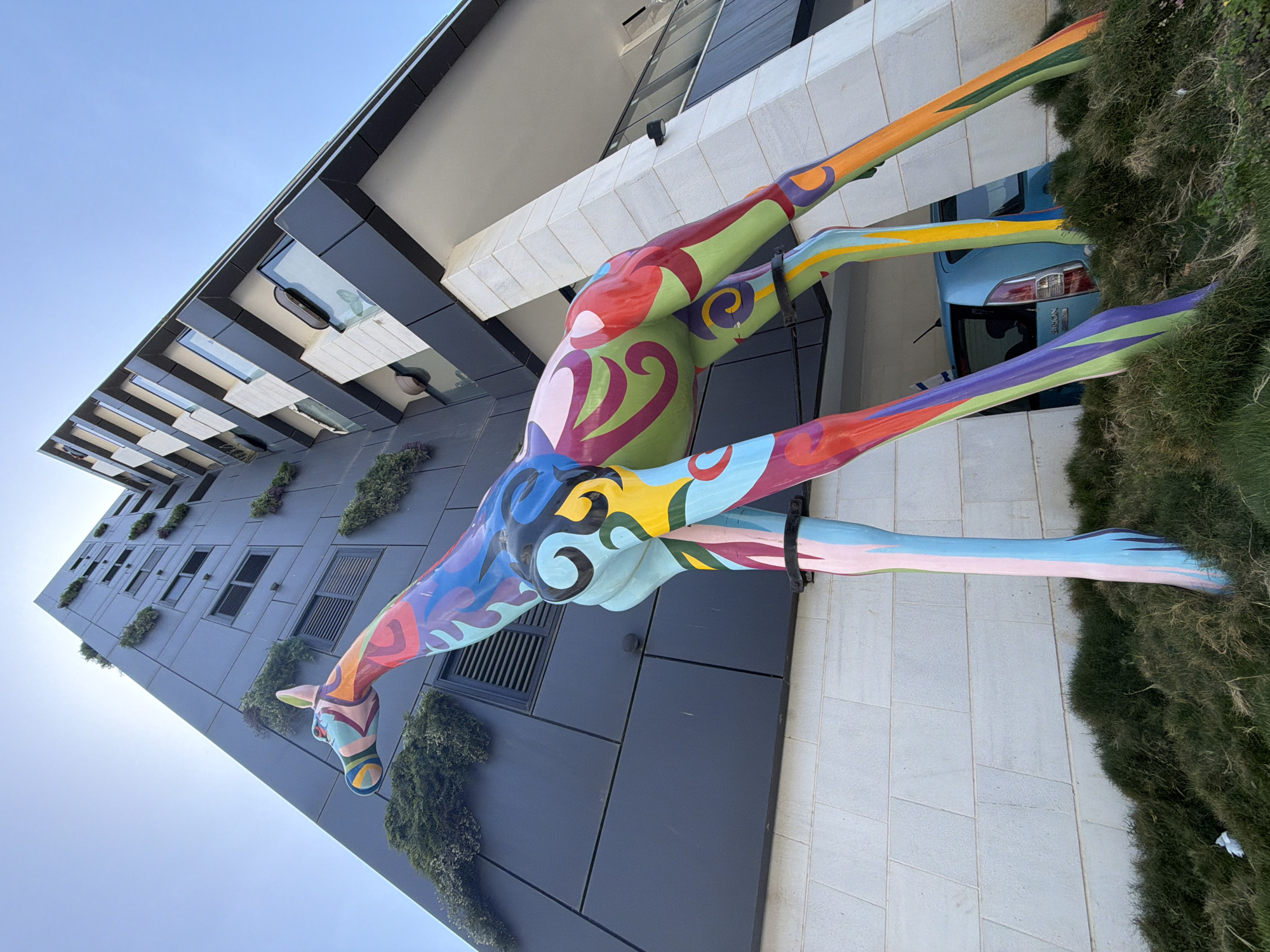 Colorful giraffe sculpture spotted on building in Bat Yam