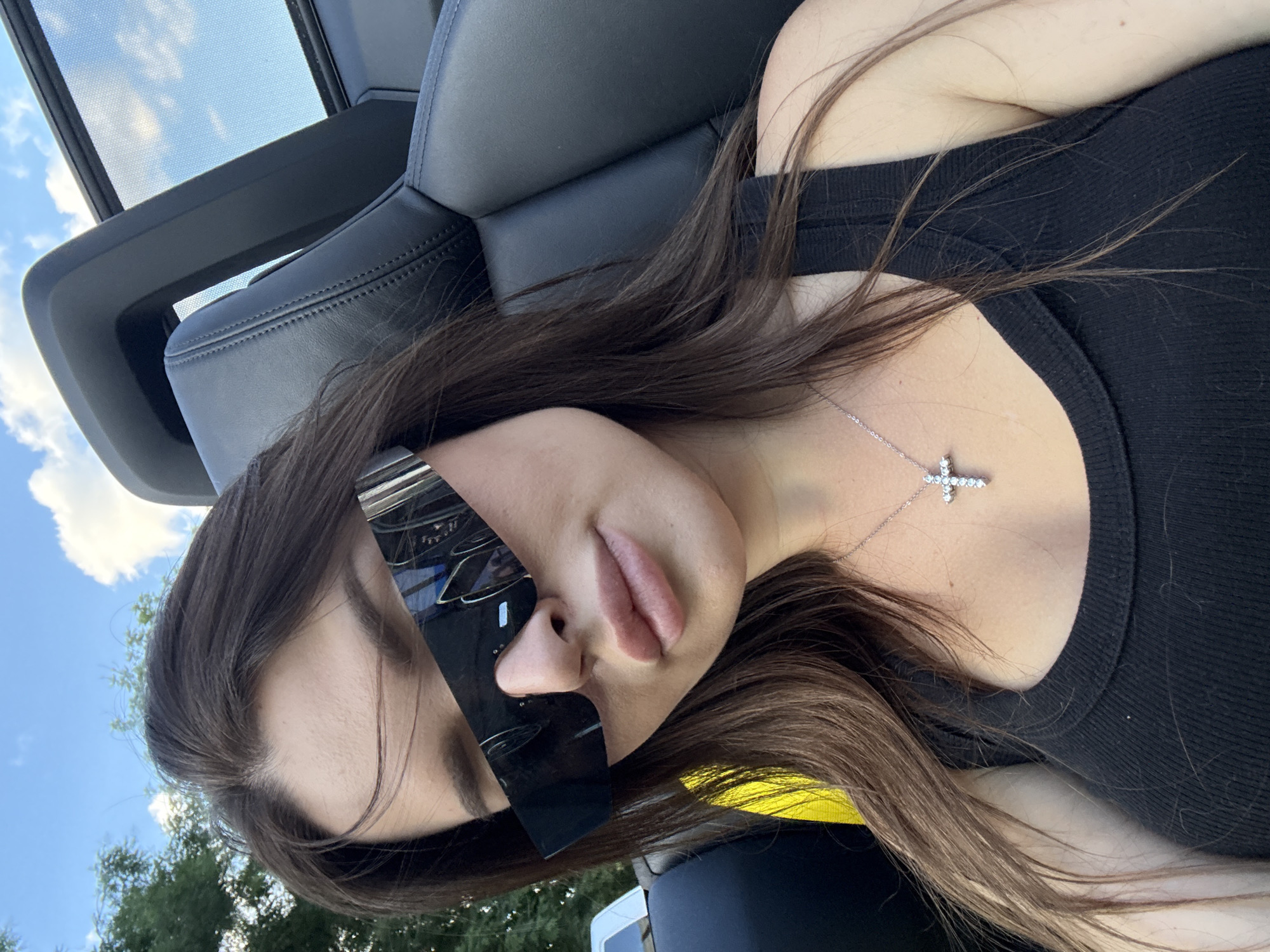 Top-down convertible ride through Prague, bold sunglasses on