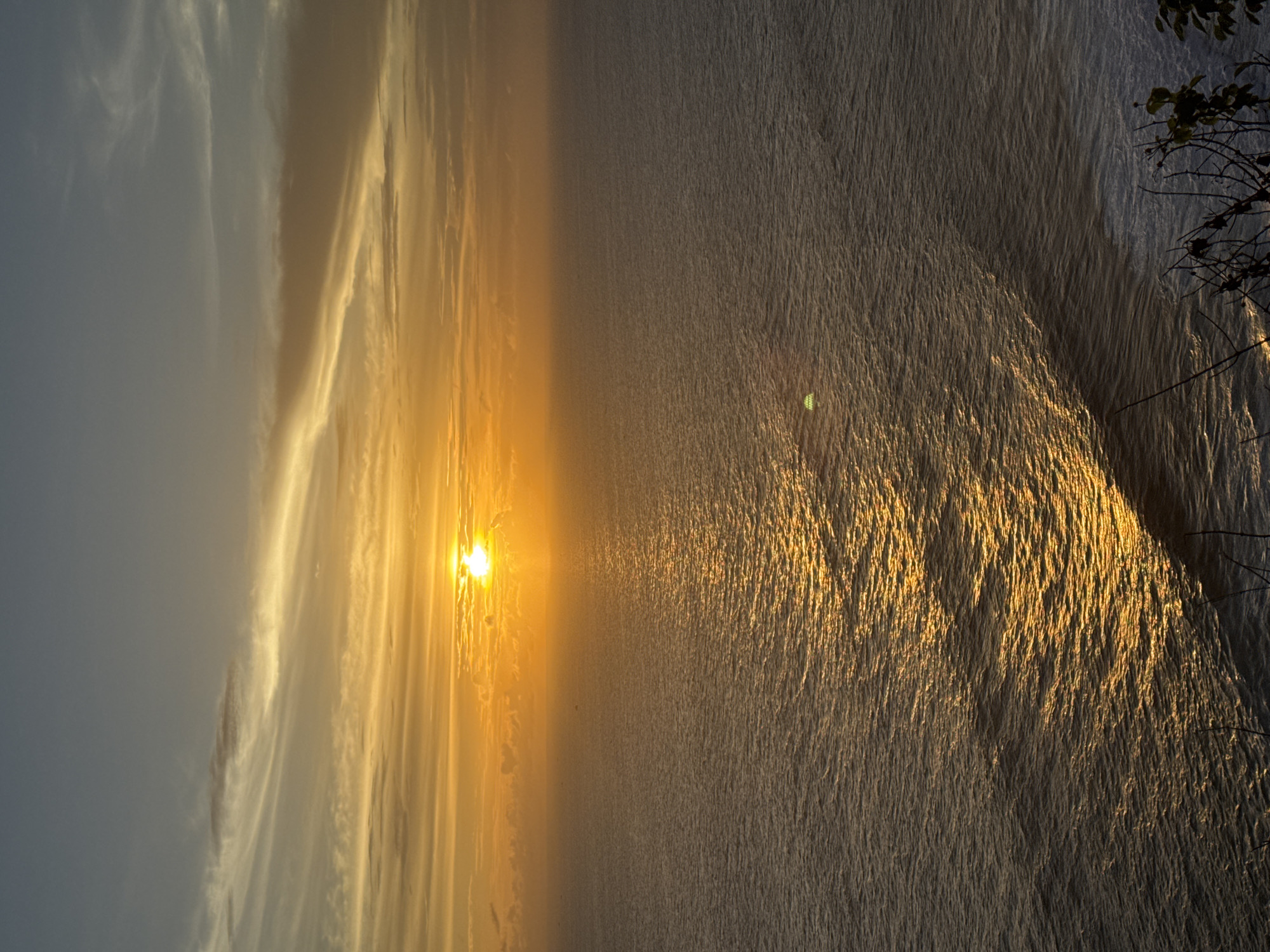 Tropical sunset and motorcycle journey documented across multiple locations