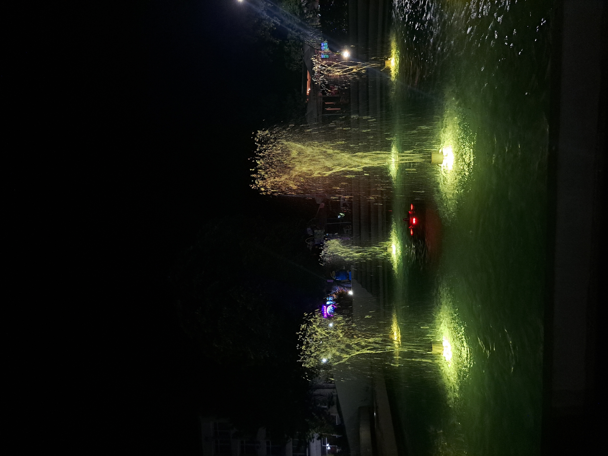 Popovo's city fountain glows through a colorful nighttime light show