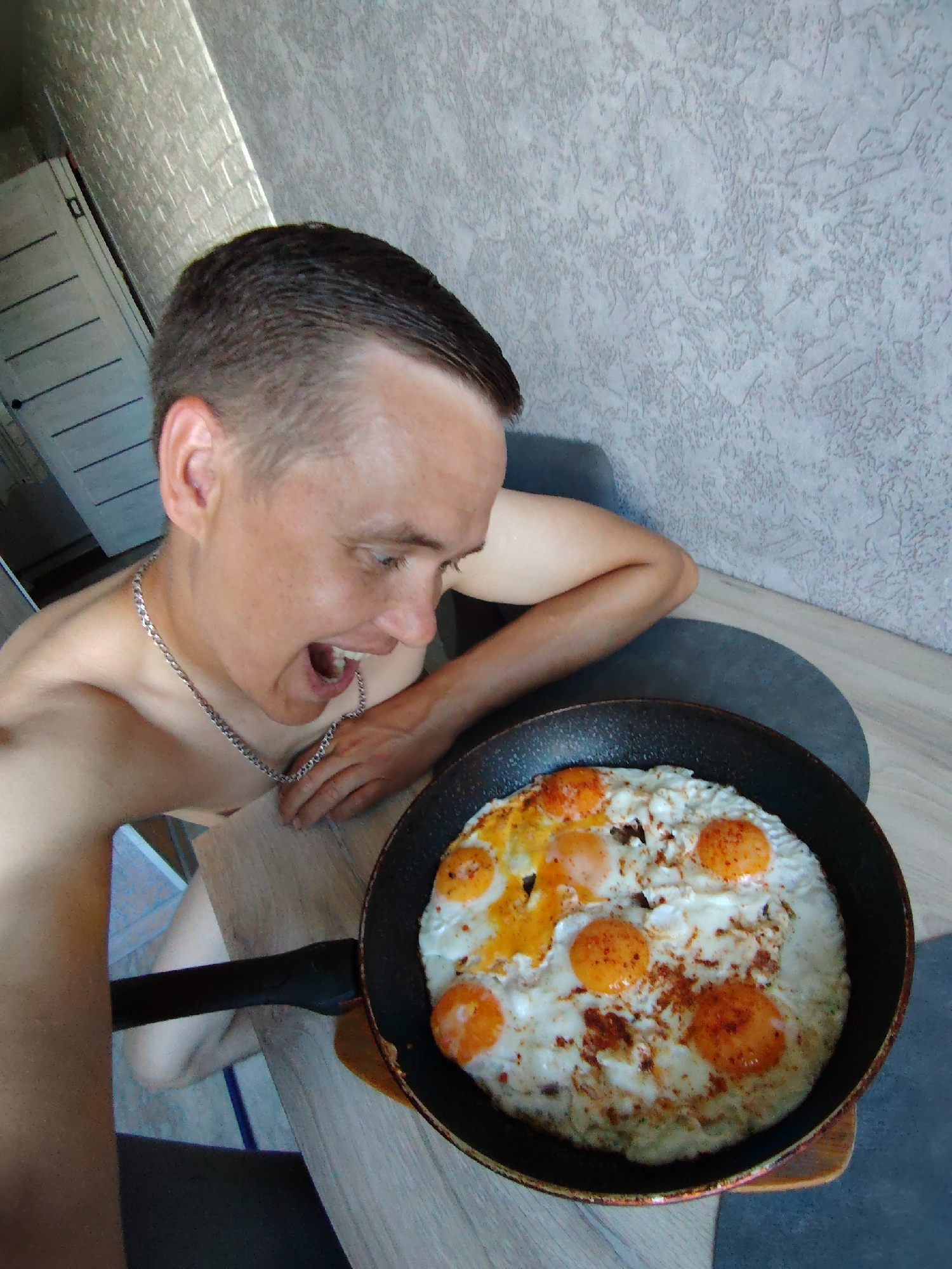 Early morning breakfast with fried eggs and toddler feeding