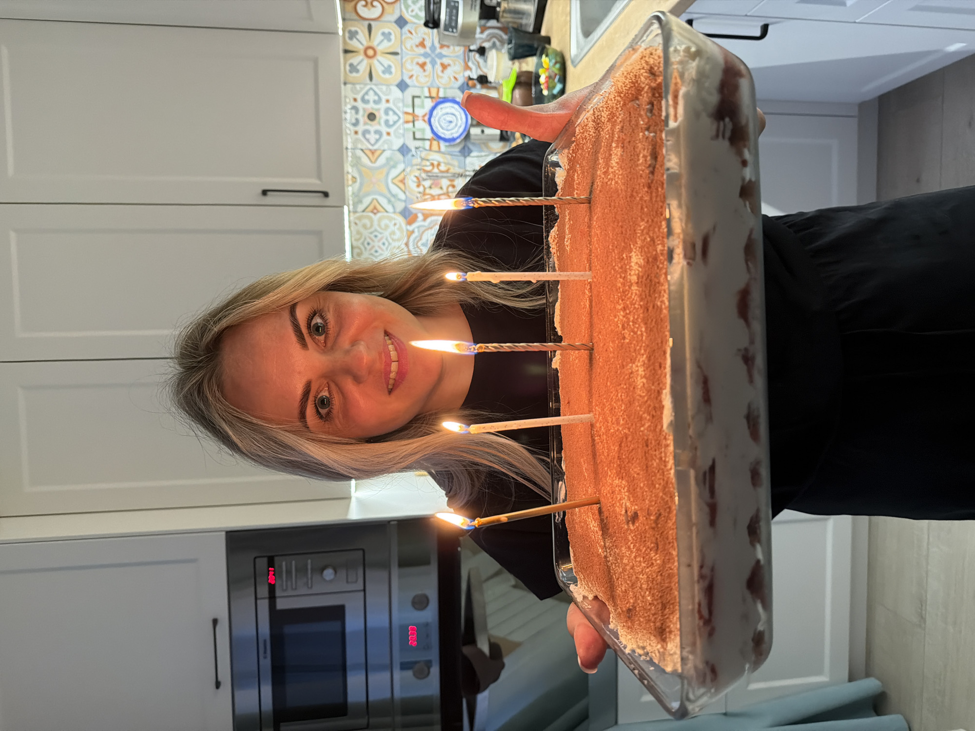 Woman celebrates birthday with tiramisu cake in Votkinsk kitchen
