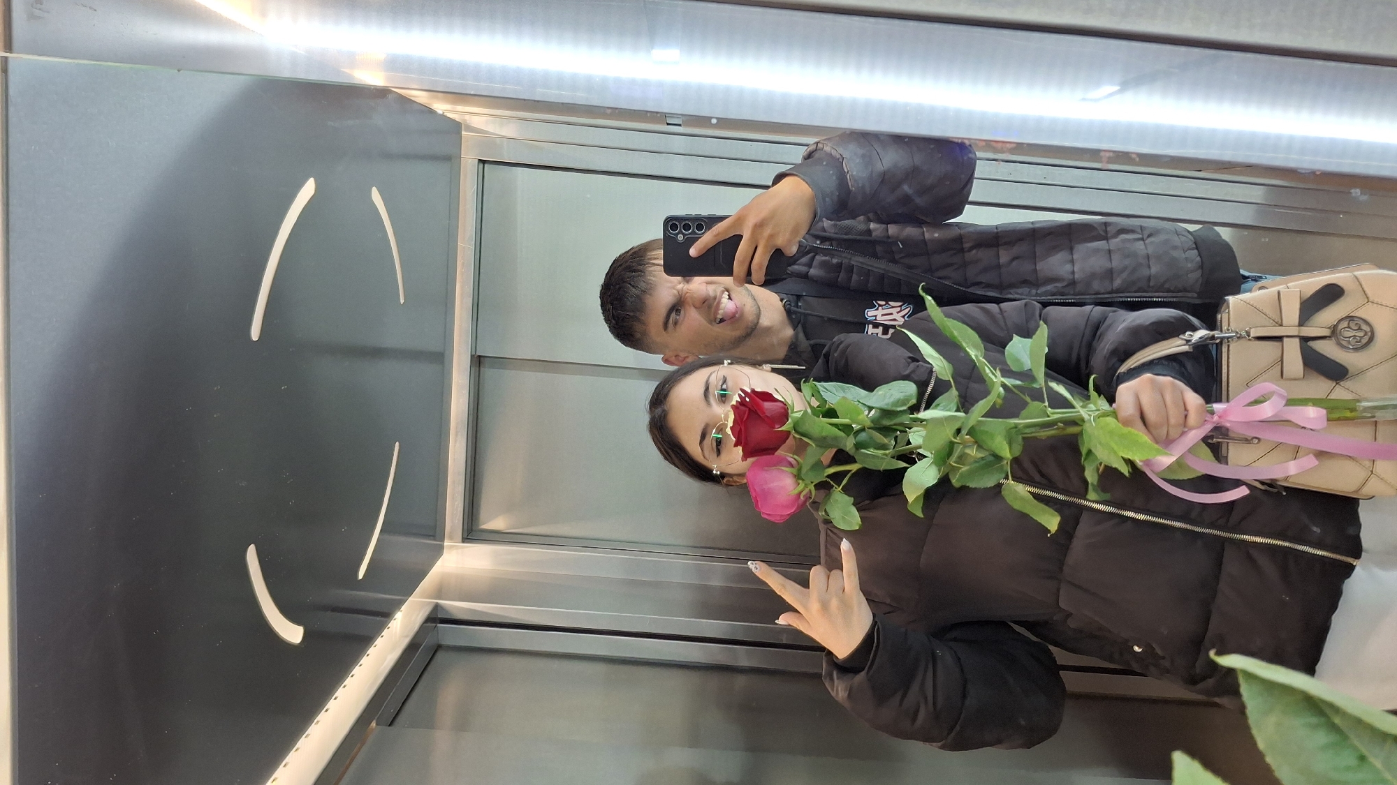 Couple Takes Selfie with Roses in Varna Elevator