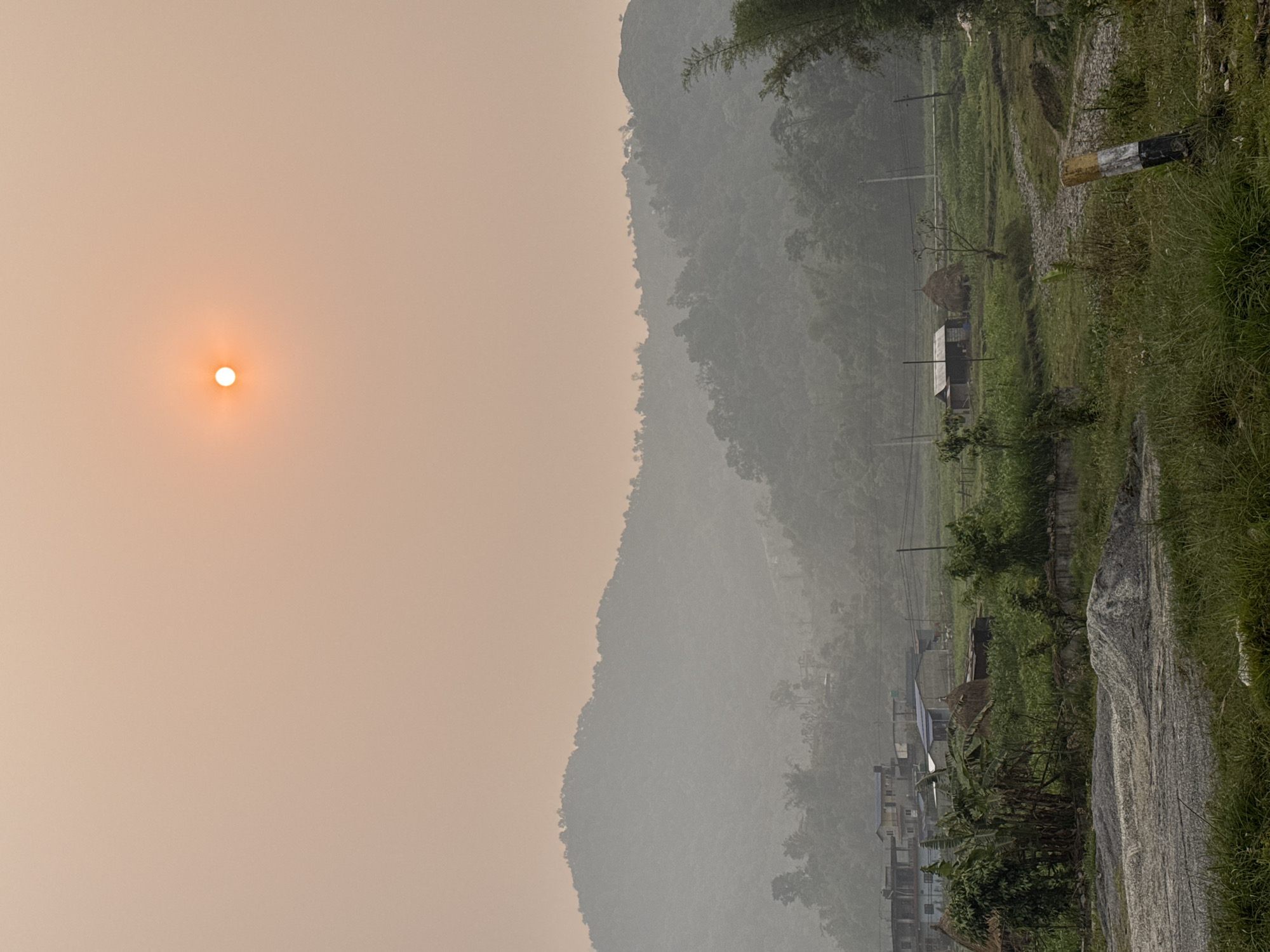 Hazy mountain landscape documented near Pokhara, Nepal