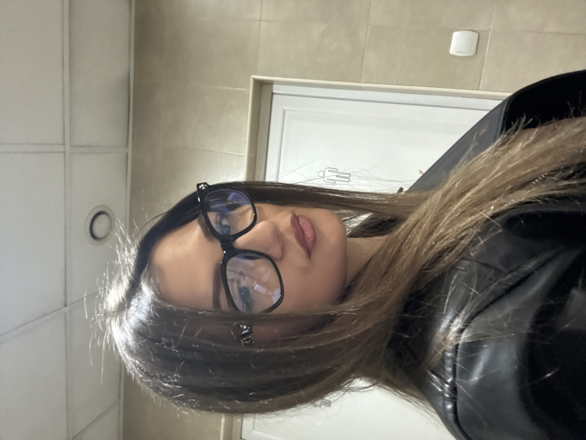 Woman takes selfie in Sofia public restroom