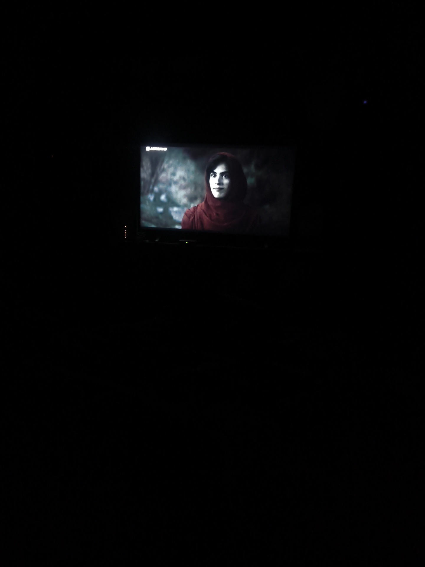 Television viewed in dark room in Bulgarian village
