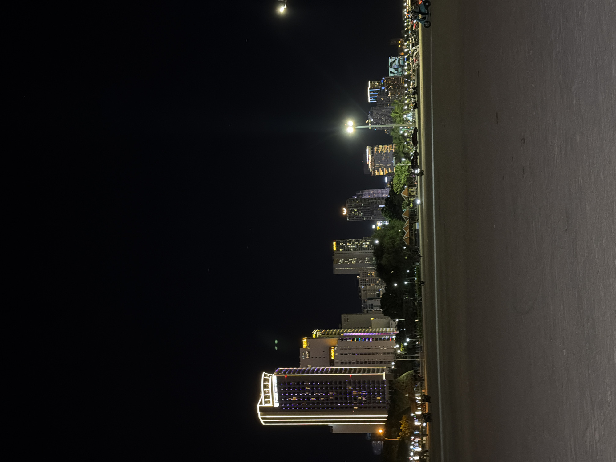 Moonlit Nha Trang cityscape captured with illuminated buildings, Pikachu sign
