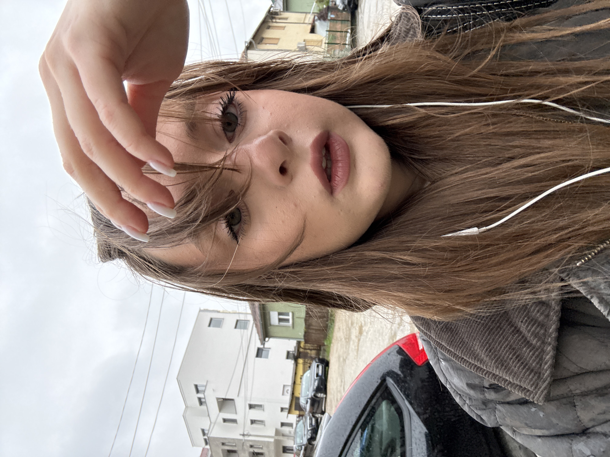Woman takes selfies on residential street in Kragujevac
