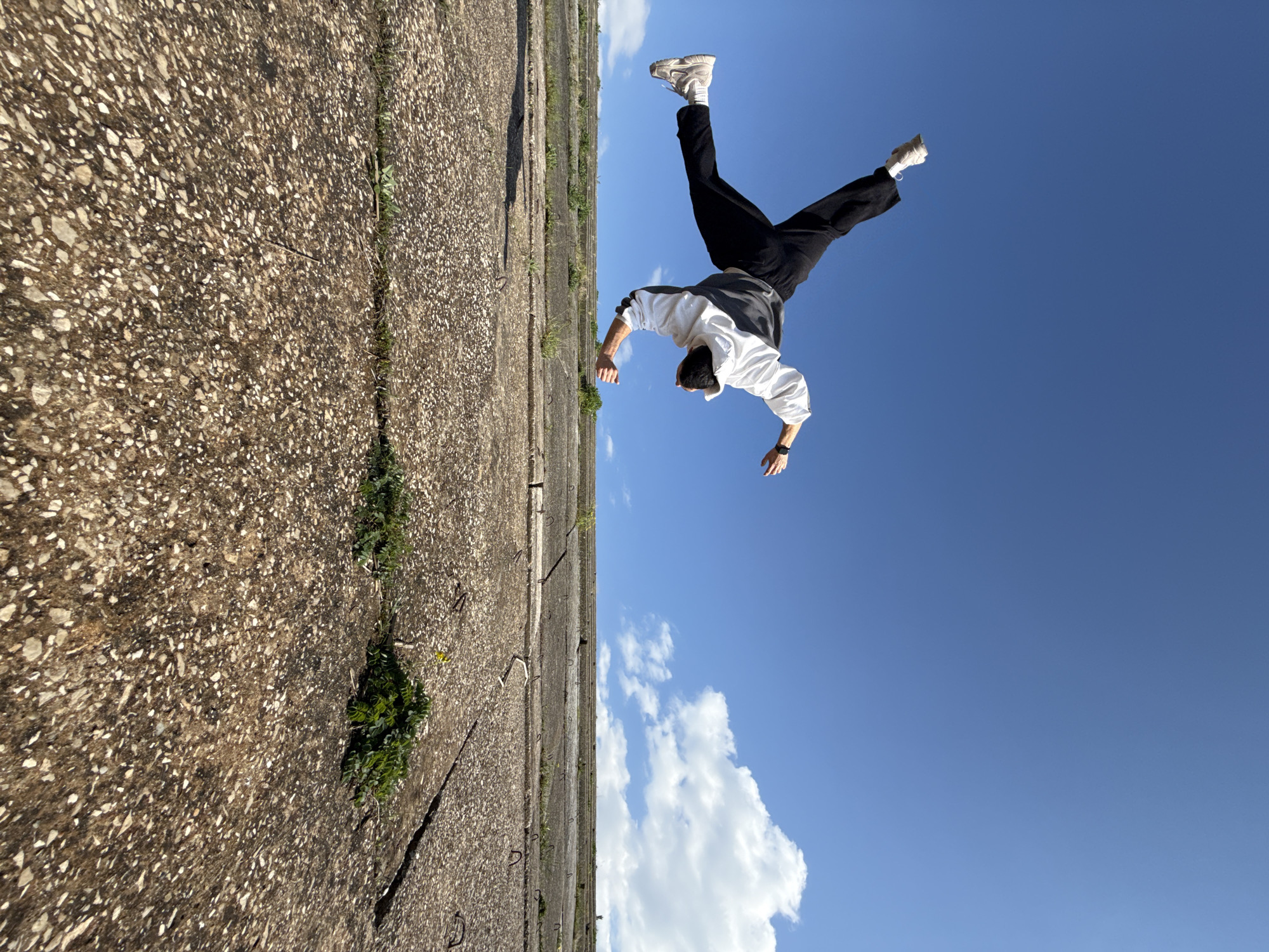 Person performs acrobatics on bridge structure in Shumen