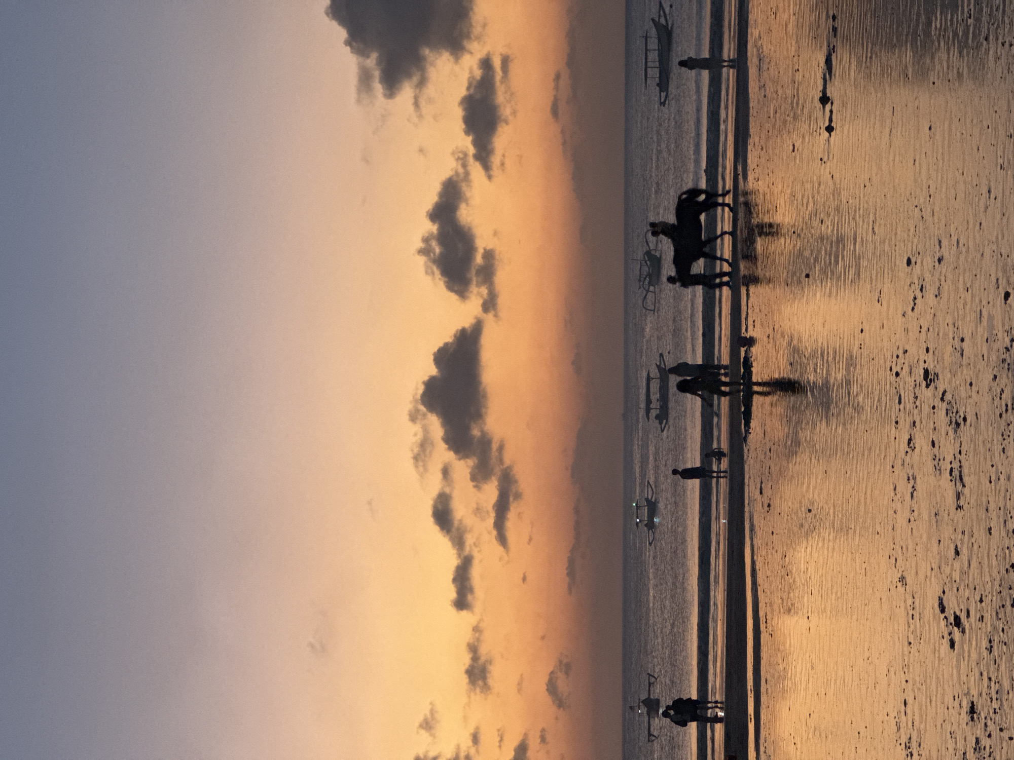 Kuta Beach at golden hour into night, Bali