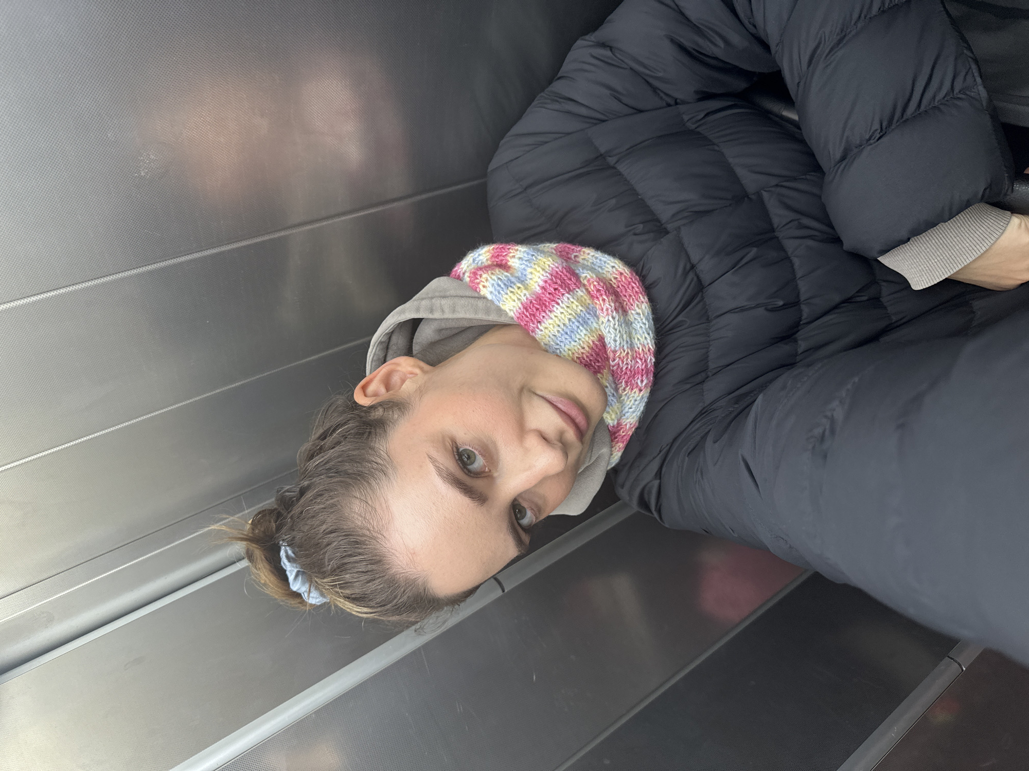 Woman takes multiple selfies around Kiel, Germany