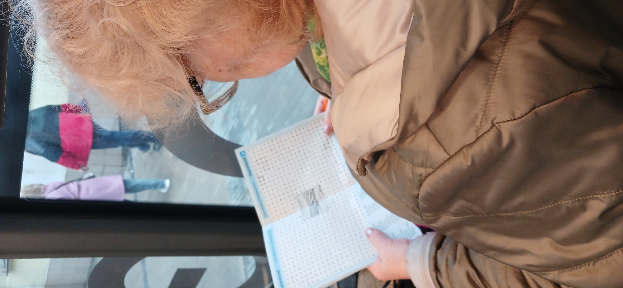 Moscow scenes: elderly woman with puzzle, storefront display observed