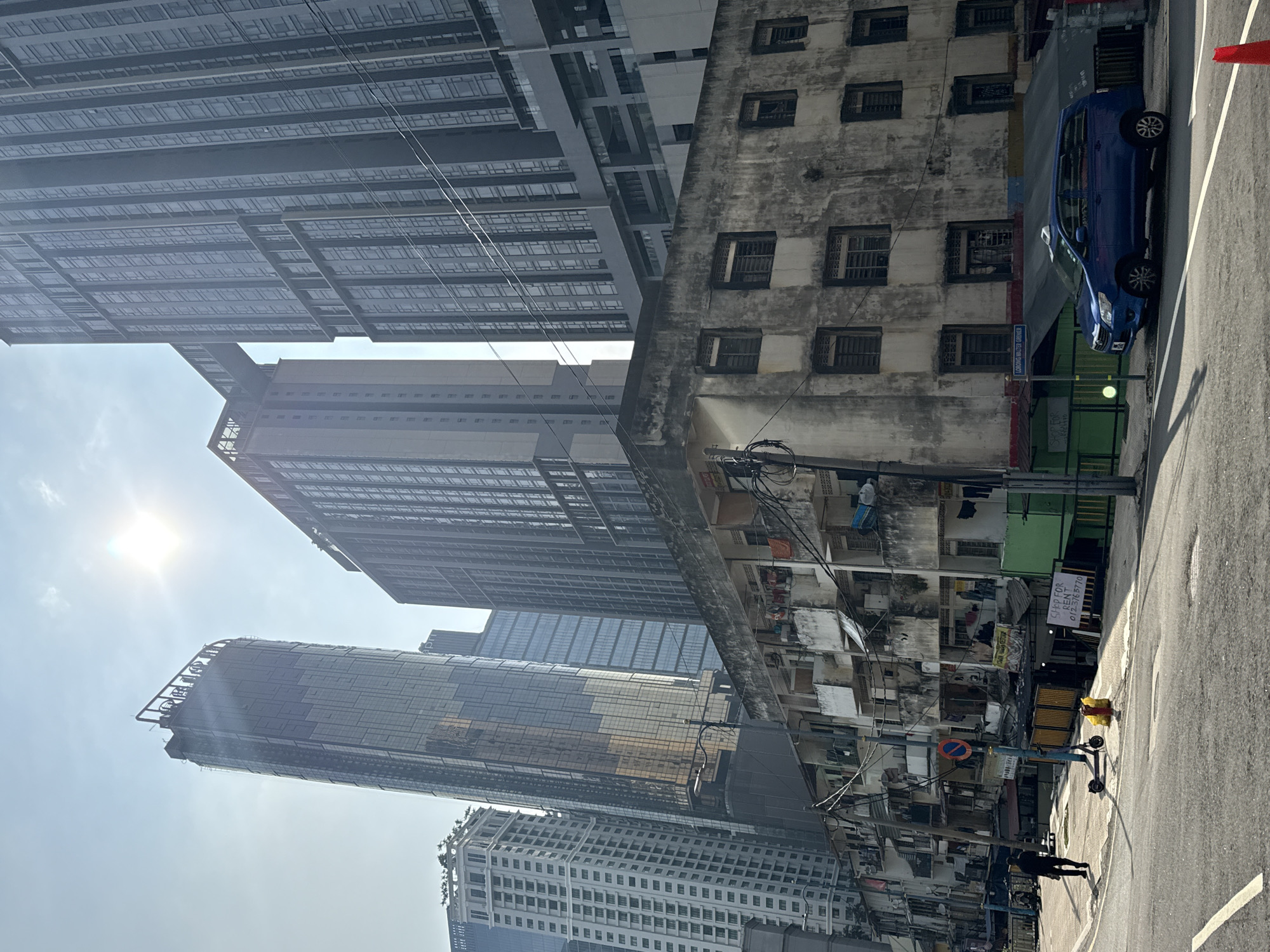 Kuala Lumpur street scenes show modern towers amid older buildings