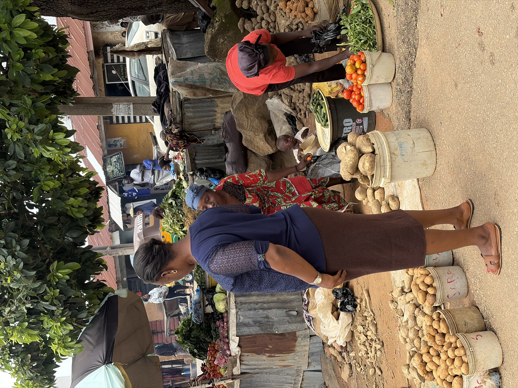 Morning street life in Jos, Nigeria — markets, motos, and foot traffic