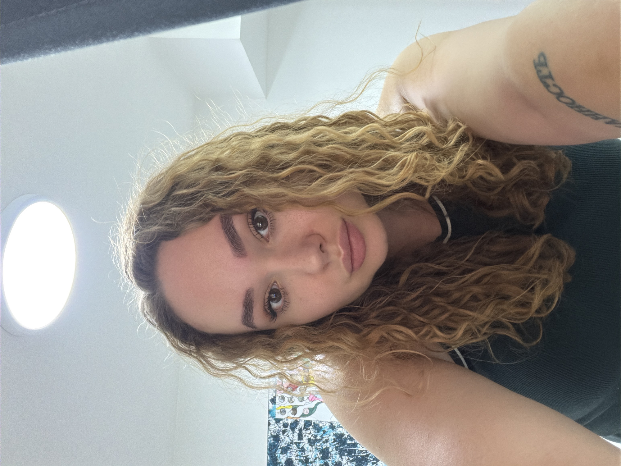 Woman enjoys quiet afternoon gaming and selfies at home