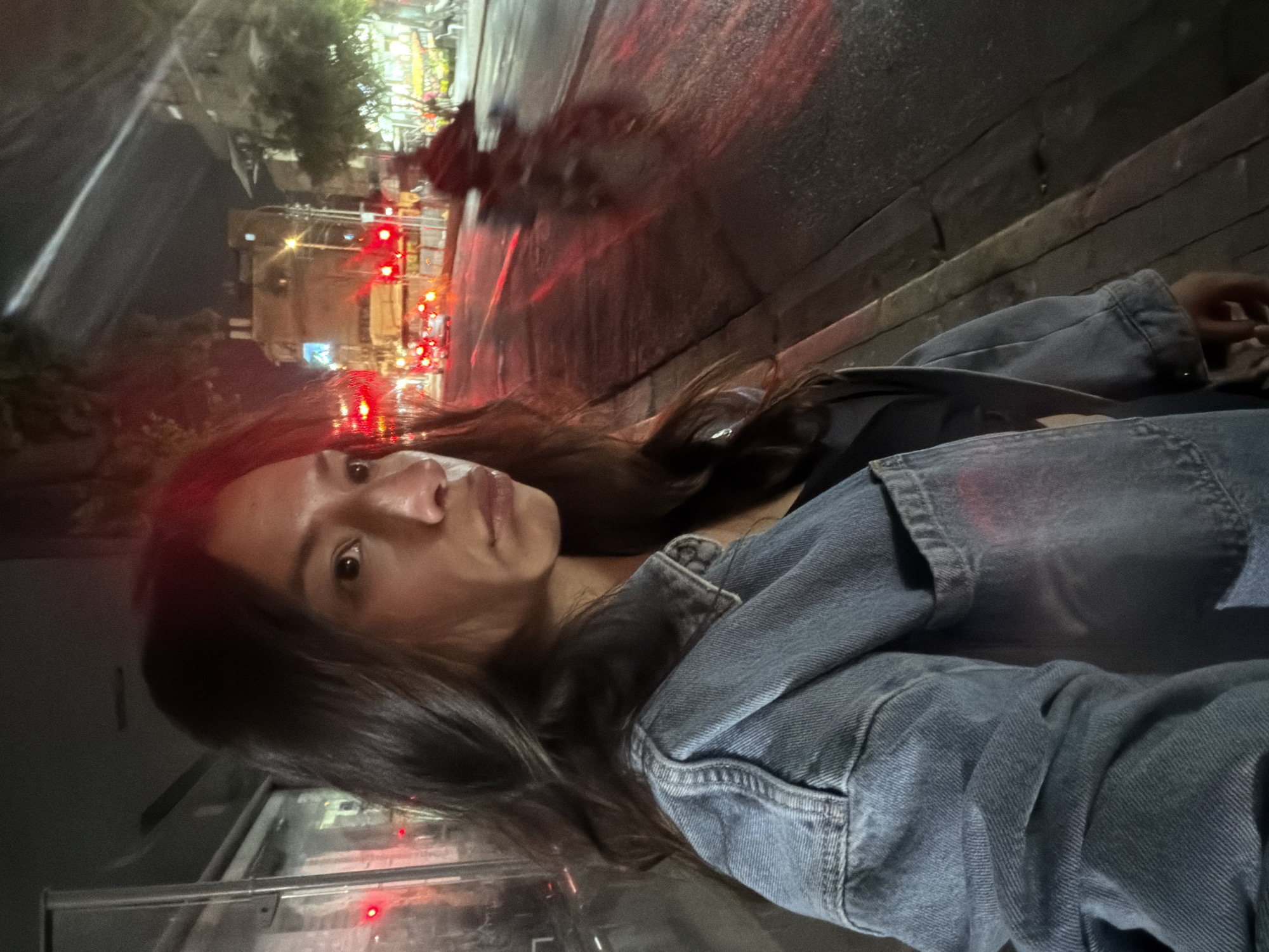 Woman photographed on Tel Aviv street with traffic backdrop