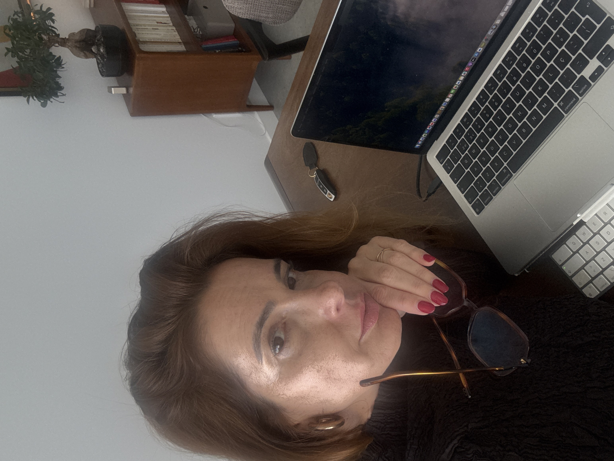 Woman at wooden desk in Torres Vedras indoor setting