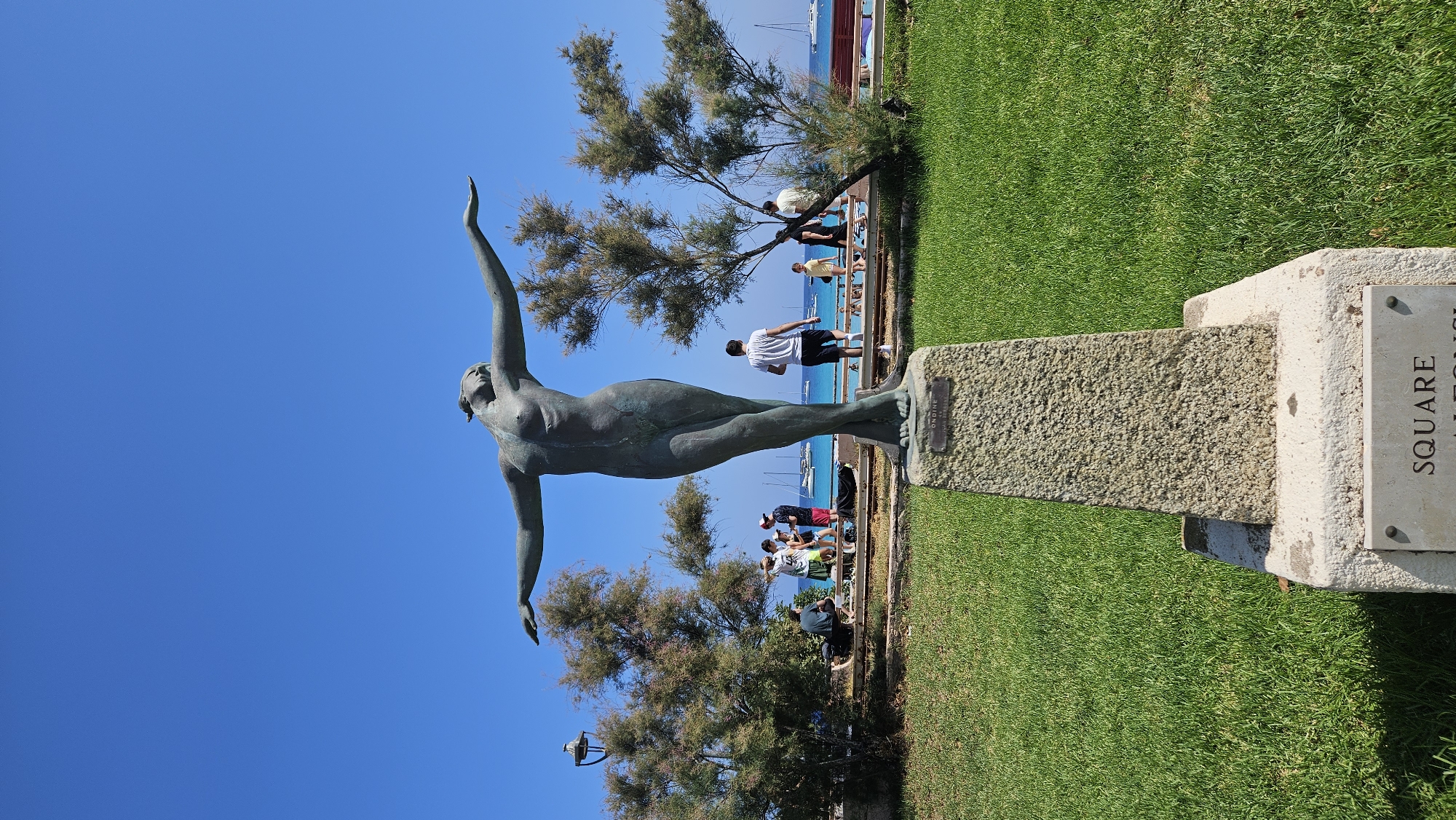 Bronze statue and model ships in L'Île-Rousse, Corsica