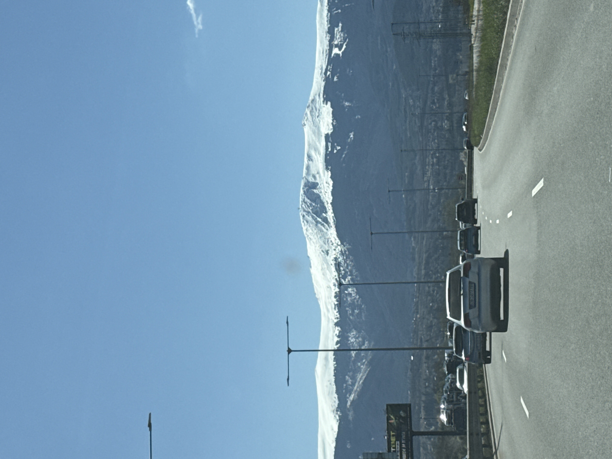 Traffic flows past snow-capped mountains in Lozen, Bulgaria