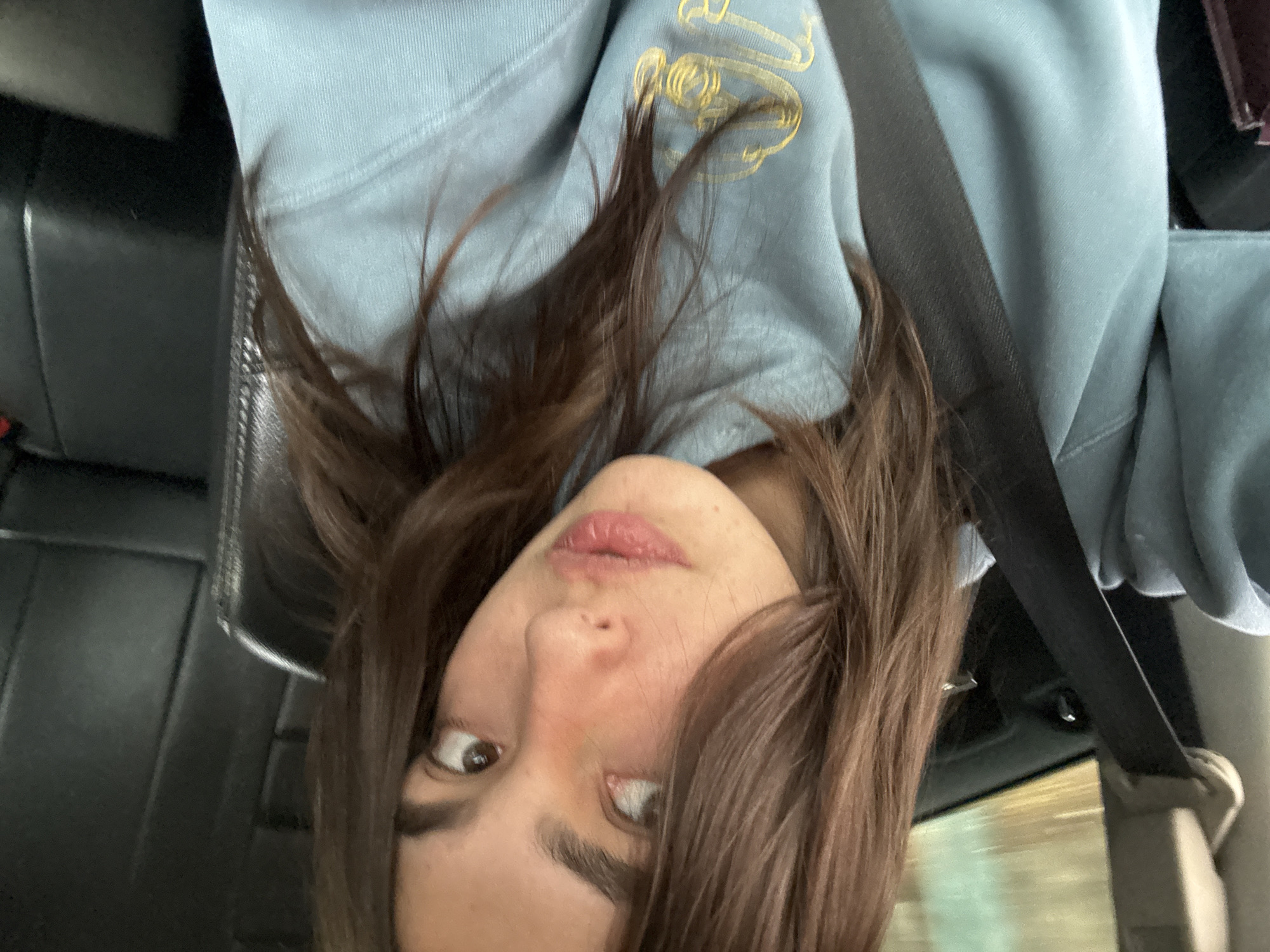 Woman in blue sweatshirt photographed in vehicle, Mexico City