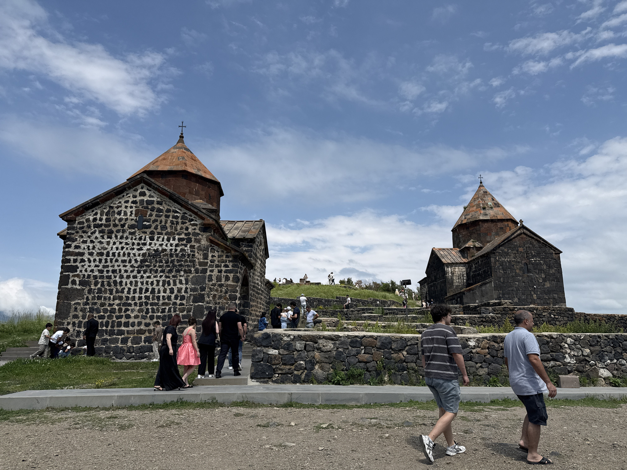 Sevanavank Monastery buzzing with visitors on a sunny July morning