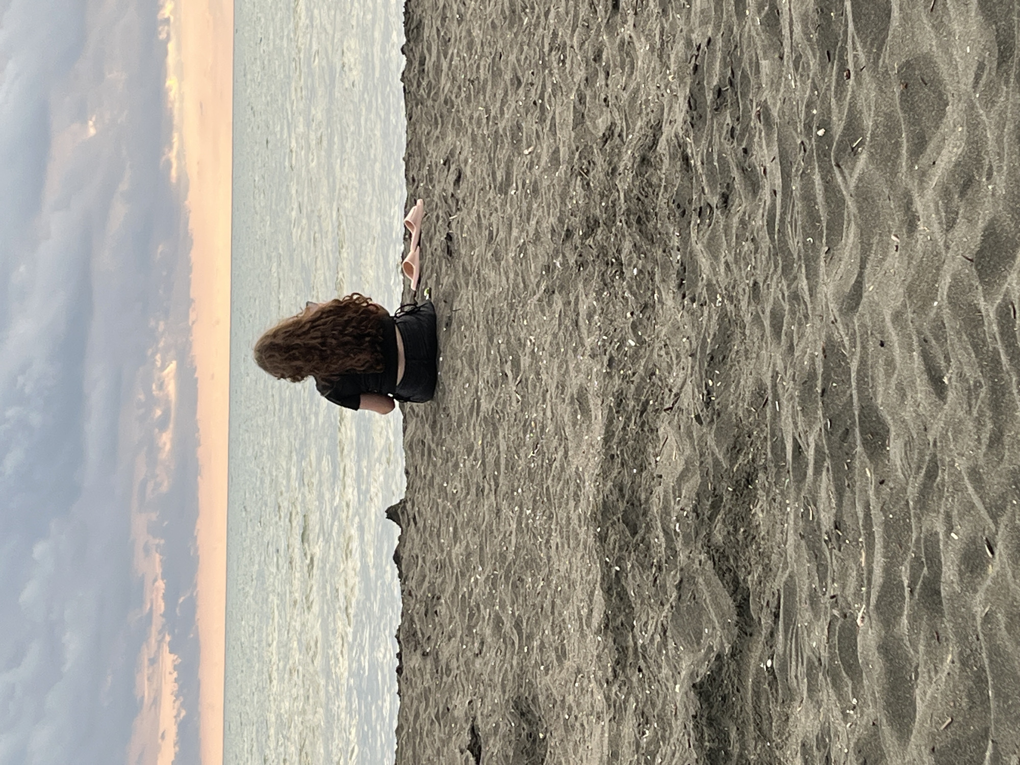 Sunset hour on Ureki's black sand beach