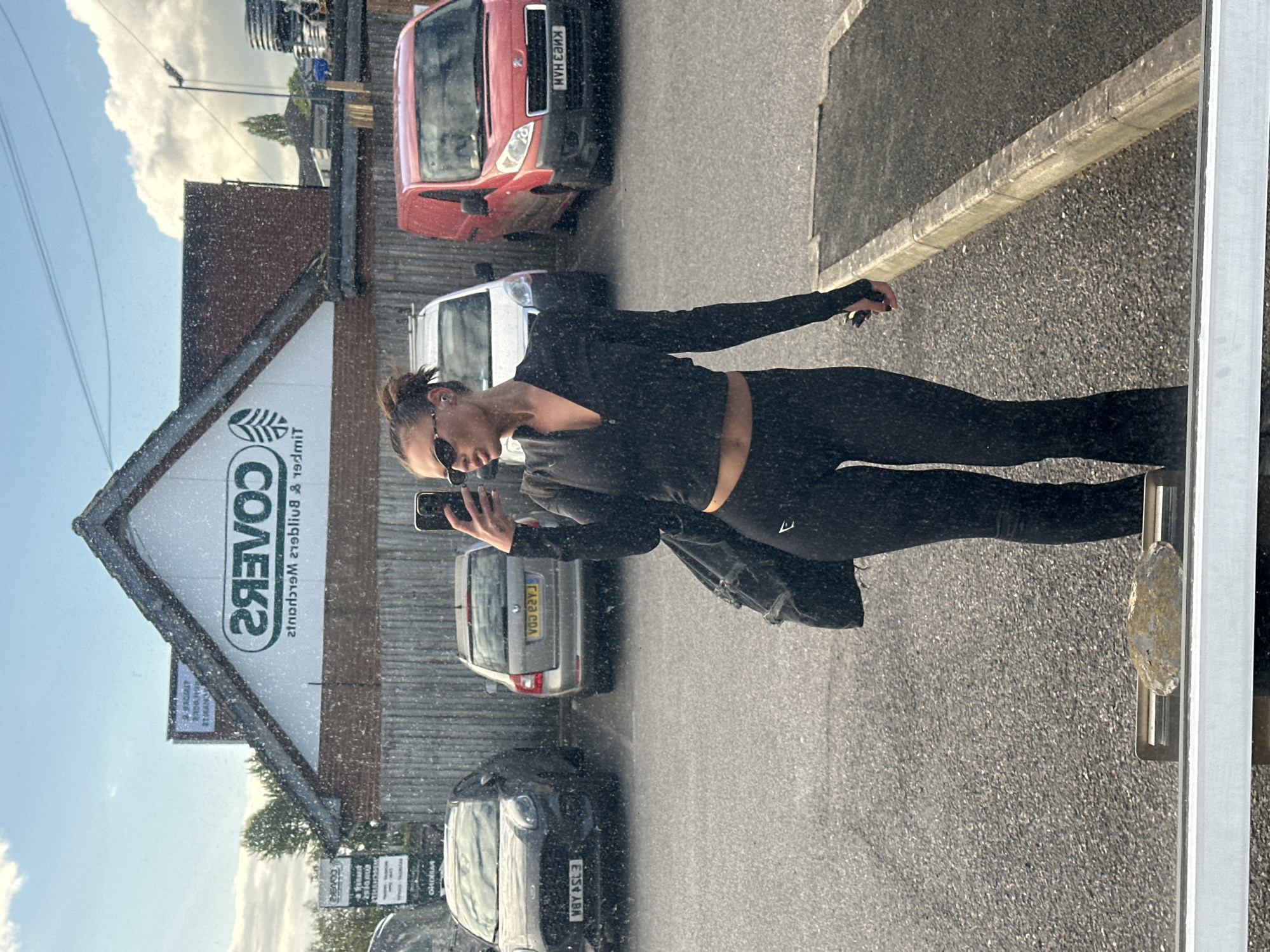 Person takes selfie in outdoor commercial area, Tonbridge
