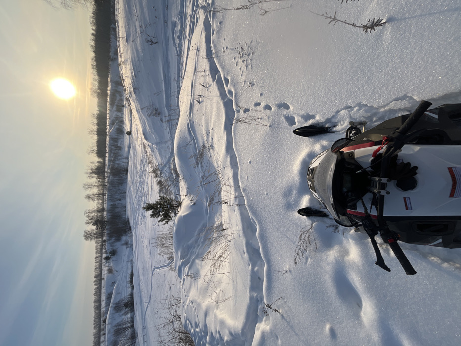 Snowmobiler captures sunny winter landscape in rural Russia