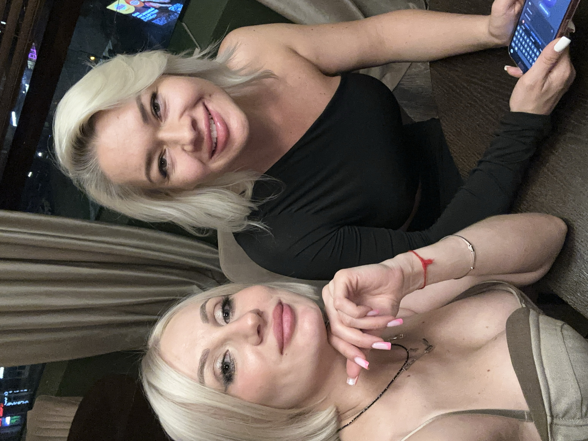 Two women pose for photos in Pushkino, Russia