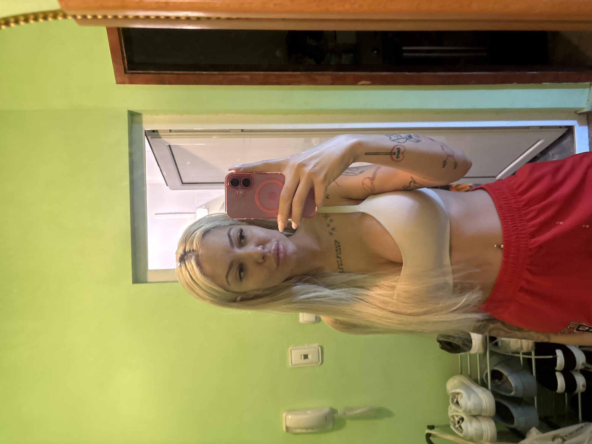 Woman takes selfie in green room in Plovdiv