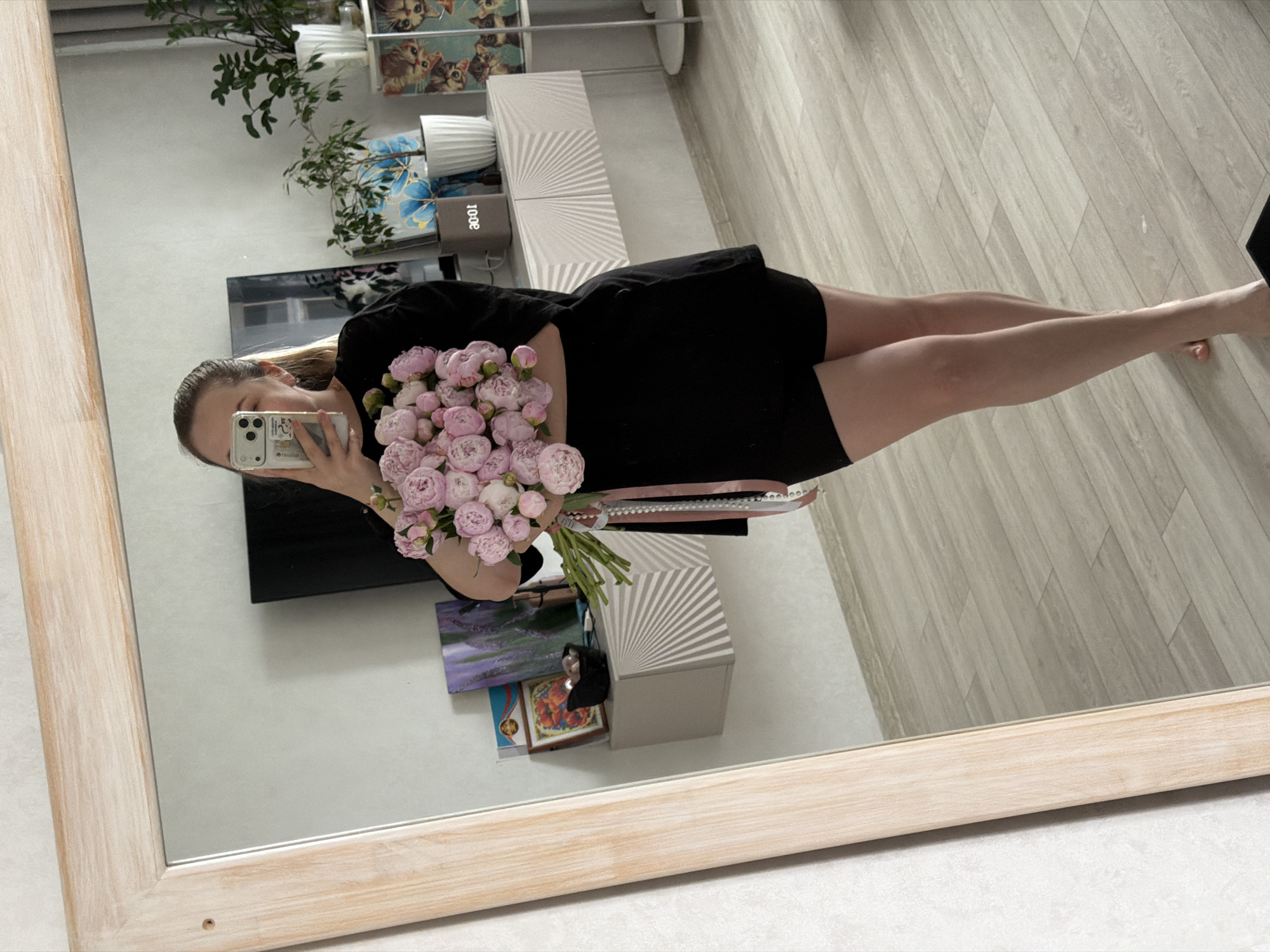 Woman receives pink peony bouquet in early morning Chaikovsky