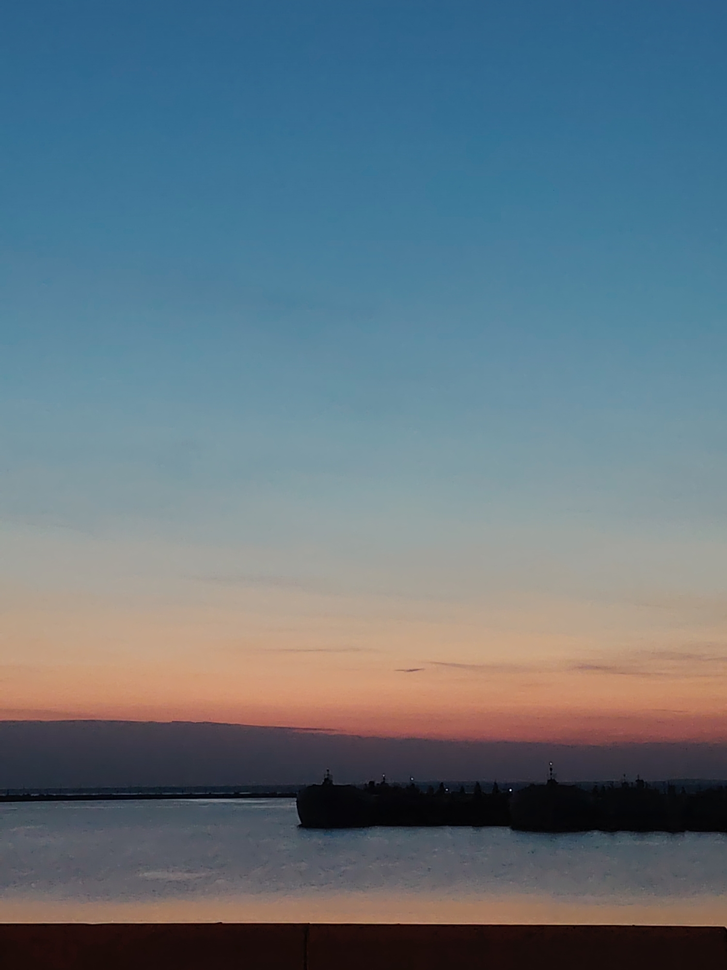 Dusk colors reflected in water observed in Chaikovsky, Russia