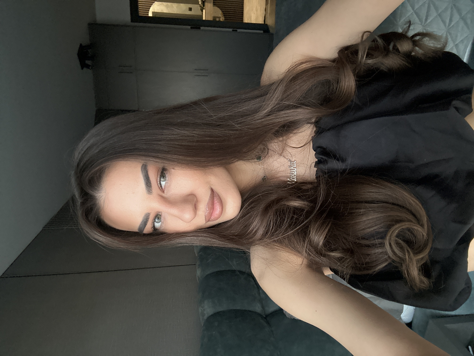 Woman takes mirror selfies in Sofia apartment bedroom