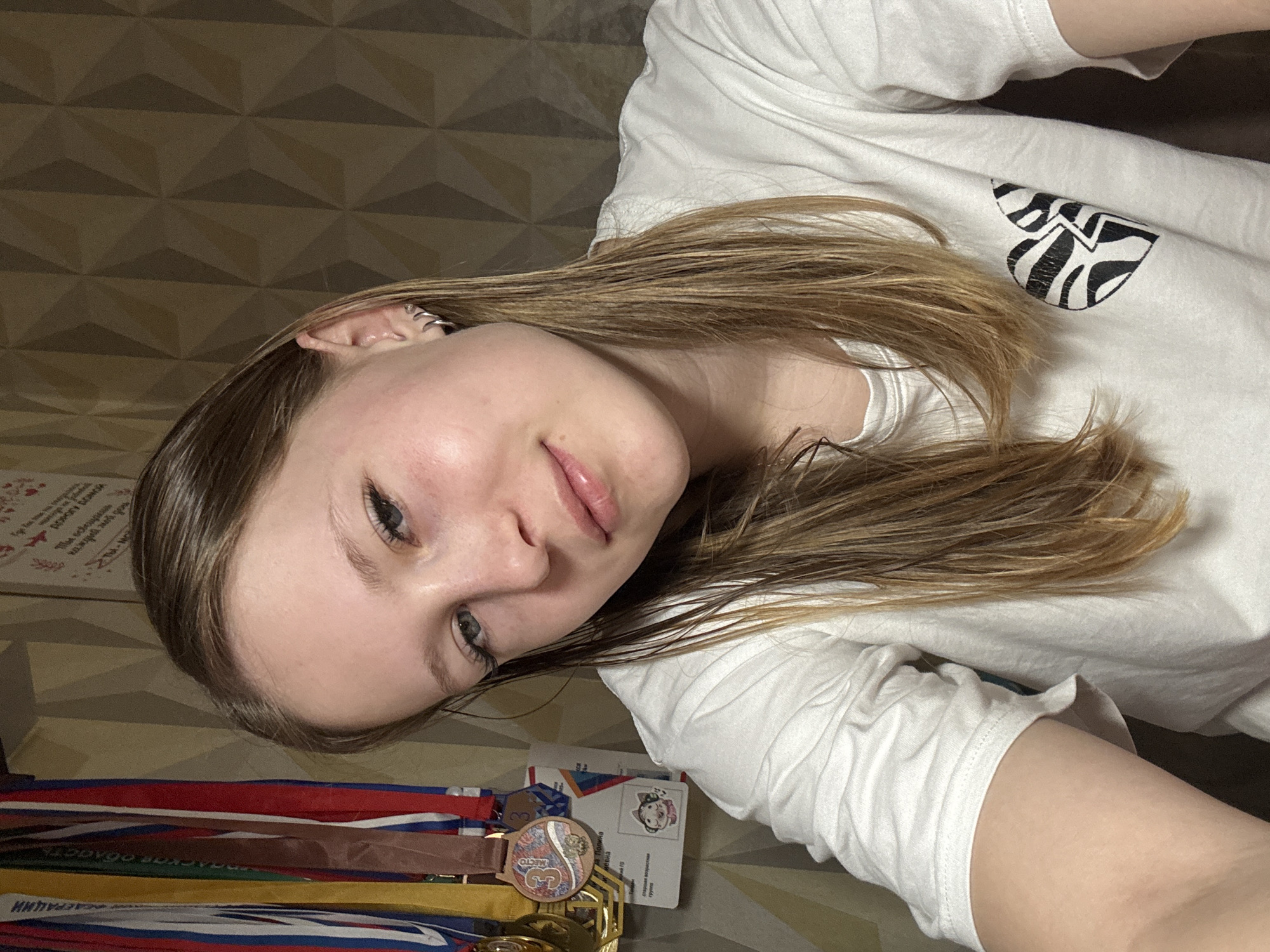 Young woman photographed indoors in Chaikovsky, Russia early morning