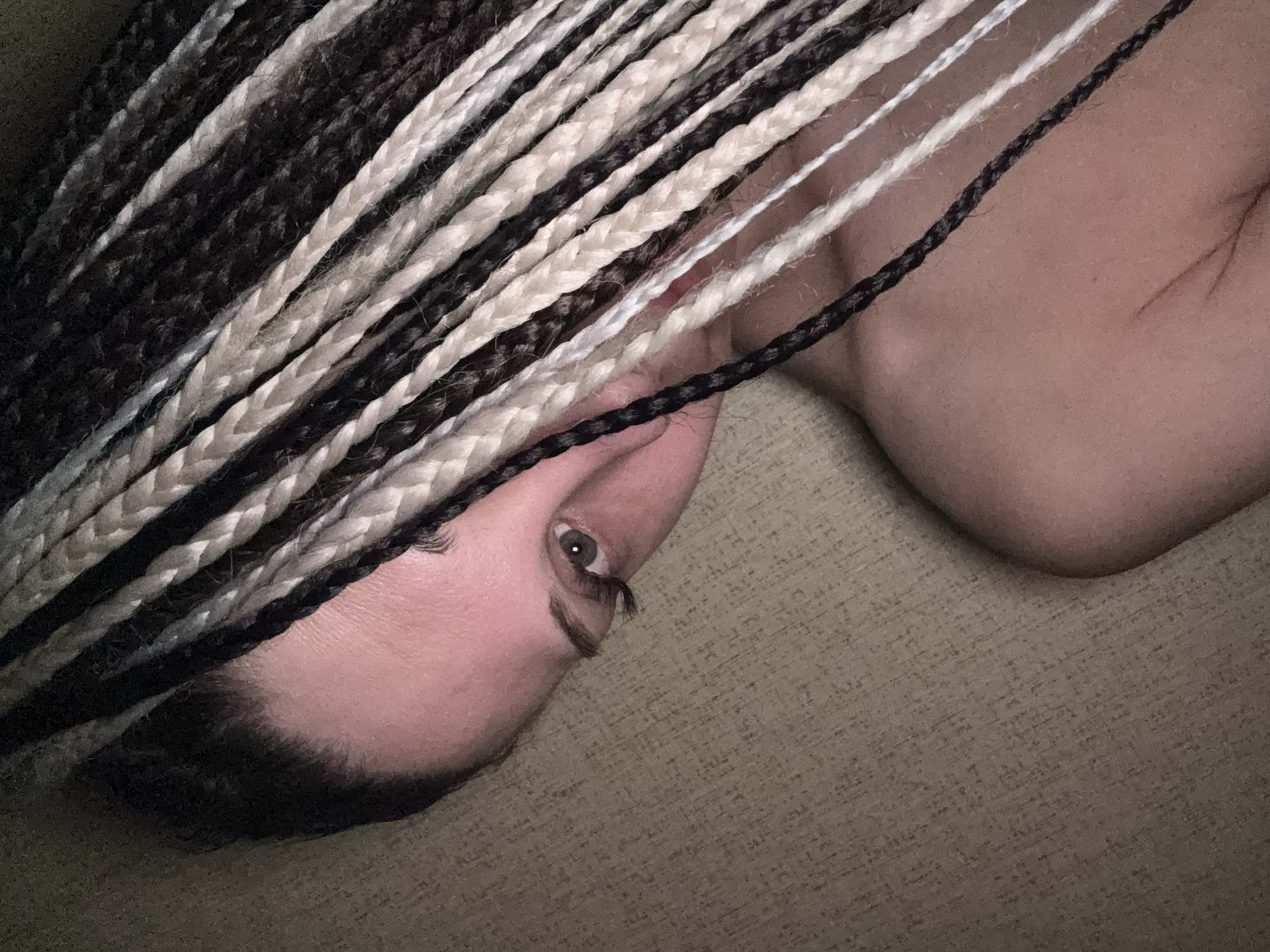 Person with braided hair photographed indoors in Rusanovo