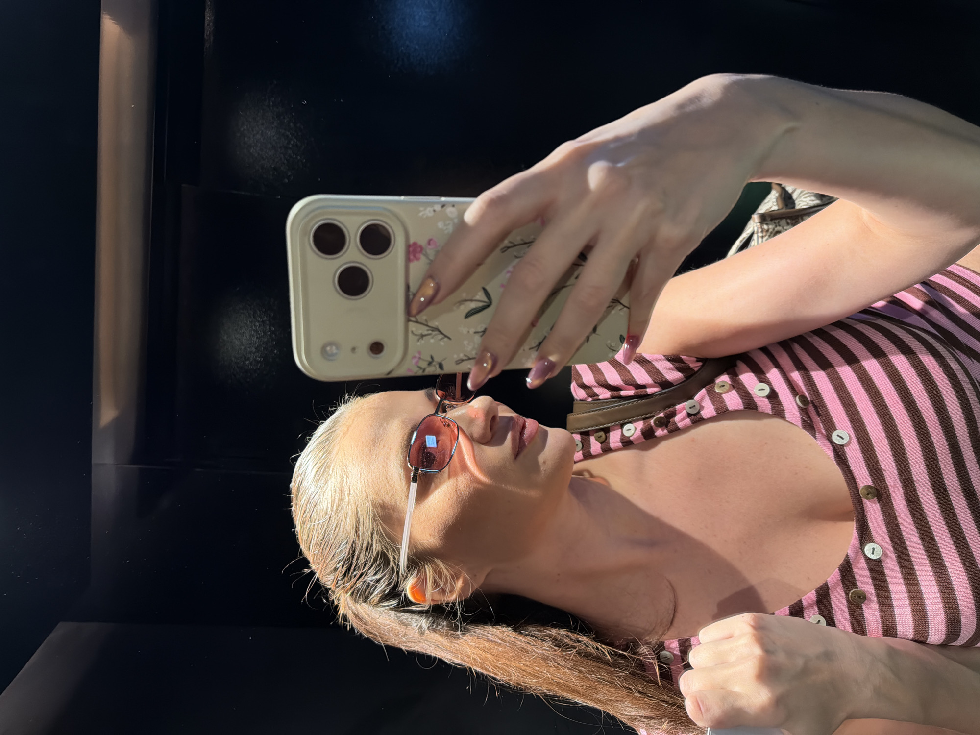 Woman takes hotel mirror selfies in Athens